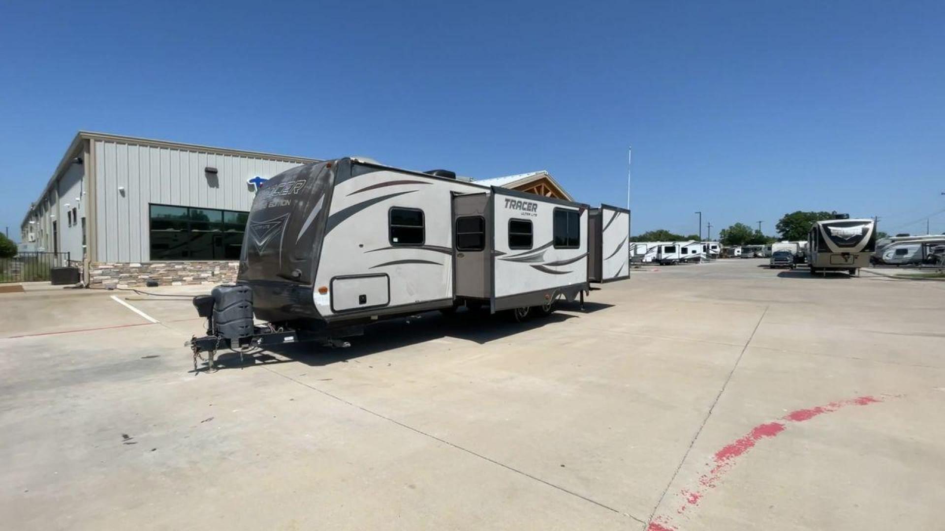 2015 WHITE FOREST RIVER TRACER 3150BHD (5ZT2TRXB5FB) , Length: 34 ft. | Dry Weight: 6,955 lbs. | Slides: 2 transmission, located at 4319 N Main St, Cleburne, TX, 76033, (817) 678-5133, 32.385960, -97.391212 - In this 2015 Forest River Tracer 3150BHD, you are guaranteed more campers, more features, and more fun! This travel trailer measures exactly 34 ft. in length with a dry weight of 6,955 lbs. and a payload capacity of 2,755 lbs. It includes two doors, two slides, and one awning. This model featu - Photo#5