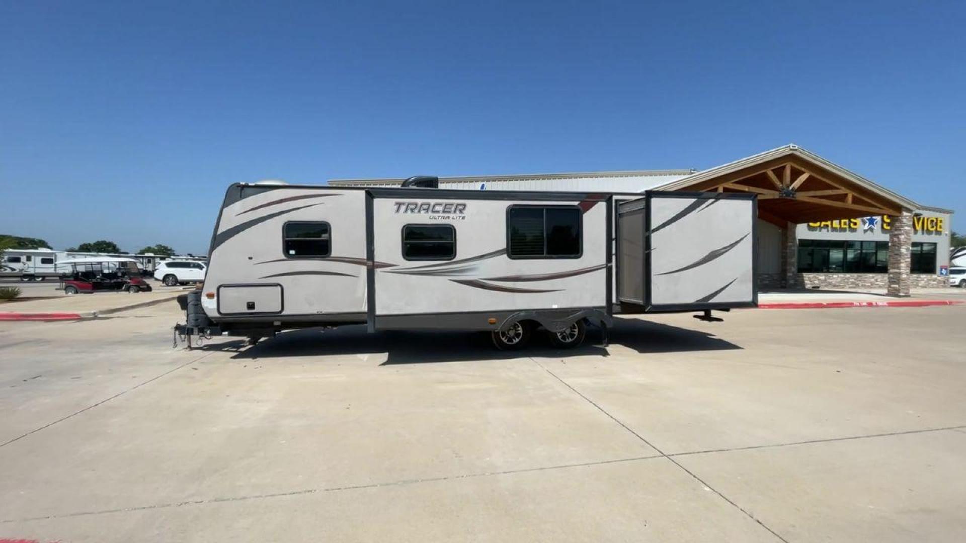 2015 WHITE FOREST RIVER TRACER 3150BHD (5ZT2TRXB5FB) , Length: 34 ft. | Dry Weight: 6,955 lbs. | Slides: 2 transmission, located at 4319 N Main St, Cleburne, TX, 76033, (817) 678-5133, 32.385960, -97.391212 - In this 2015 Forest River Tracer 3150BHD, you are guaranteed more campers, more features, and more fun! This travel trailer measures exactly 34 ft. in length with a dry weight of 6,955 lbs. and a payload capacity of 2,755 lbs. It includes two doors, two slides, and one awning. This model featu - Photo#6