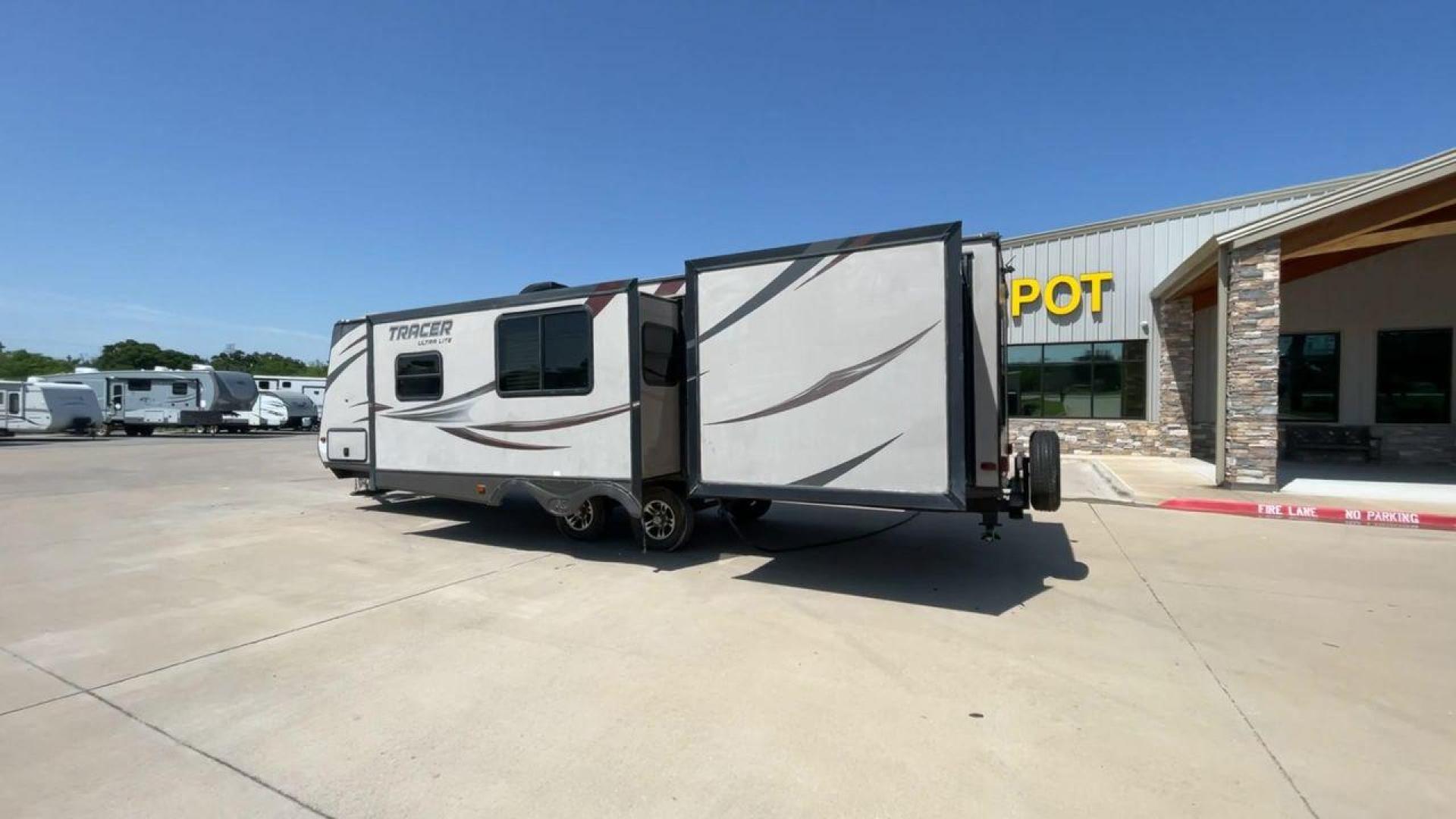 2015 WHITE FOREST RIVER TRACER 3150BHD (5ZT2TRXB5FB) , Length: 34 ft. | Dry Weight: 6,955 lbs. | Slides: 2 transmission, located at 4319 N Main St, Cleburne, TX, 76033, (817) 678-5133, 32.385960, -97.391212 - In this 2015 Forest River Tracer 3150BHD, you are guaranteed more campers, more features, and more fun! This travel trailer measures exactly 34 ft. in length with a dry weight of 6,955 lbs. and a payload capacity of 2,755 lbs. It includes two doors, two slides, and one awning. This model featu - Photo#7