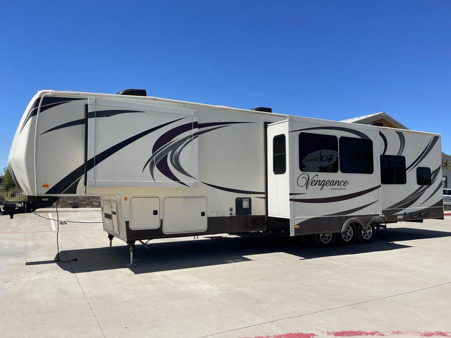 2015 TAN FOREST RIVER VENGEANCE - (4X4FVGR30FR) , Length: 42.83 ft. | Dry Weight: 14,270 lbs. | Gross Weight: 17,500 lbs. | Slides: 3 transmission, located at 4319 N Main St, Cleburne, TX, 76033, (817) 678-5133, 32.385960, -97.391212 - Designed to provide comfort and adventure to your travels, the 2015 Forest River Vengeance 39B12 is a tough and adaptable fifth wheel toy hauler. With a dry weight of 14,270 pounds and a length of a little over 42 feet, this model offers plenty of room for your belongings while still being towable - Photo#23