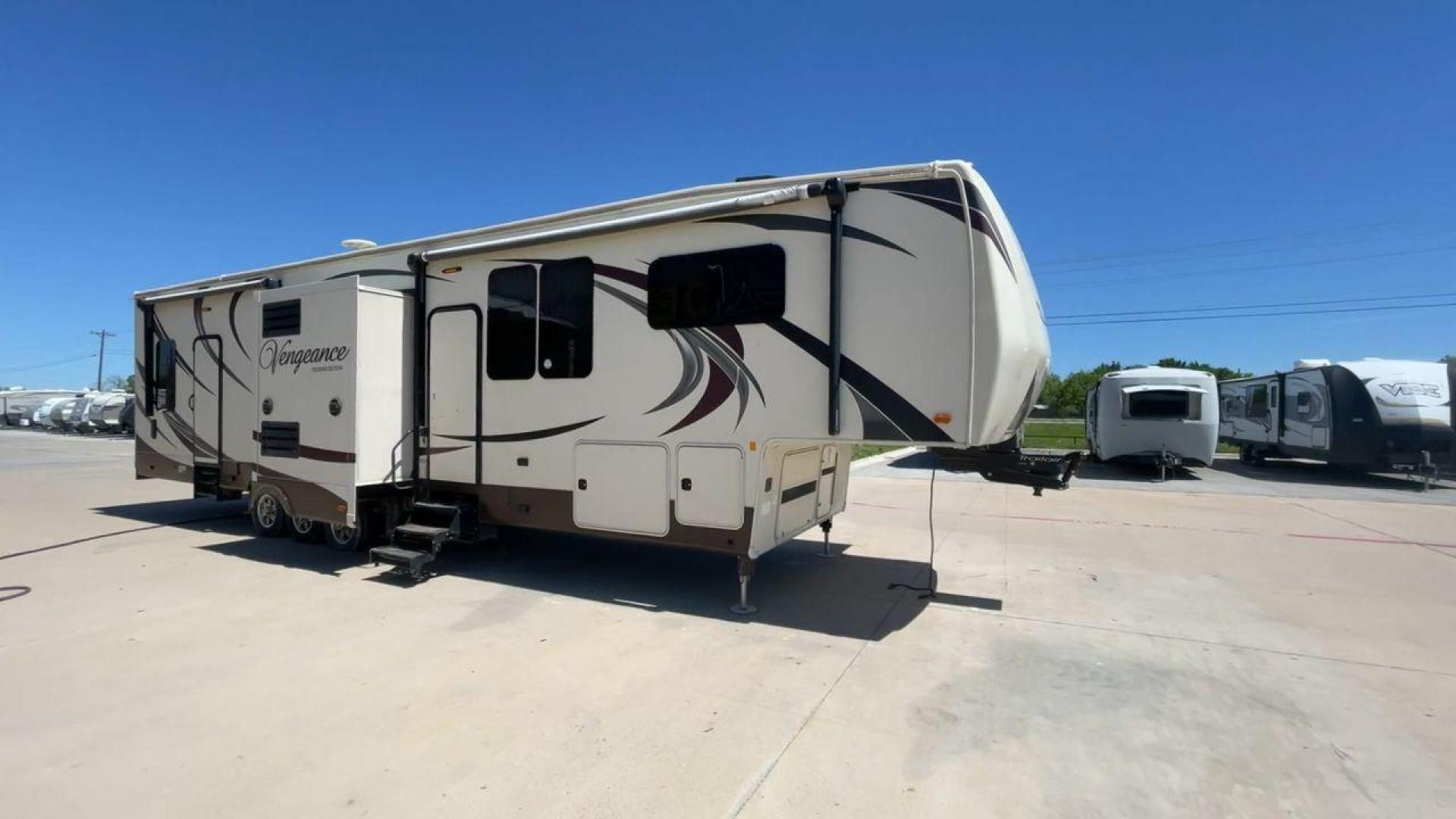 2015 TAN FOREST RIVER VENGEANCE - (4X4FVGR30FR) , Length: 42.83 ft. | Dry Weight: 14,270 lbs. | Gross Weight: 17,500 lbs. | Slides: 3 transmission, located at 4319 N Main St, Cleburne, TX, 76033, (817) 678-5133, 32.385960, -97.391212 - Designed to provide comfort and adventure to your travels, the 2015 Forest River Vengeance 39B12 is a tough and adaptable fifth wheel toy hauler. With a dry weight of 14,270 pounds and a length of a little over 42 feet, this model offers plenty of room for your belongings while still being towable - Photo#3