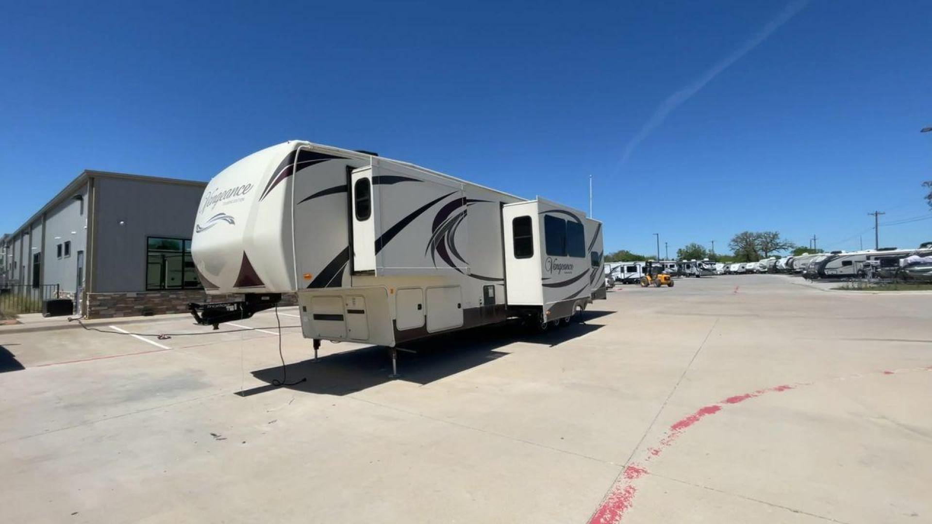 2015 TAN FOREST RIVER VENGEANCE - (4X4FVGR30FR) , Length: 42.83 ft. | Dry Weight: 14,270 lbs. | Gross Weight: 17,500 lbs. | Slides: 3 transmission, located at 4319 N Main St, Cleburne, TX, 76033, (817) 678-5133, 32.385960, -97.391212 - Designed to provide comfort and adventure to your travels, the 2015 Forest River Vengeance 39B12 is a tough and adaptable fifth wheel toy hauler. With a dry weight of 14,270 pounds and a length of a little over 42 feet, this model offers plenty of room for your belongings while still being towable - Photo#5