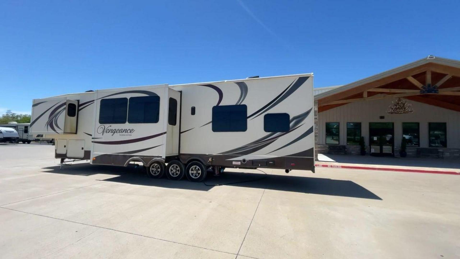 2015 TAN FOREST RIVER VENGEANCE - (4X4FVGR30FR) , Length: 42.83 ft. | Dry Weight: 14,270 lbs. | Gross Weight: 17,500 lbs. | Slides: 3 transmission, located at 4319 N Main St, Cleburne, TX, 76033, (817) 678-5133, 32.385960, -97.391212 - Designed to provide comfort and adventure to your travels, the 2015 Forest River Vengeance 39B12 is a tough and adaptable fifth wheel toy hauler. With a dry weight of 14,270 pounds and a length of a little over 42 feet, this model offers plenty of room for your belongings while still being towable - Photo#7