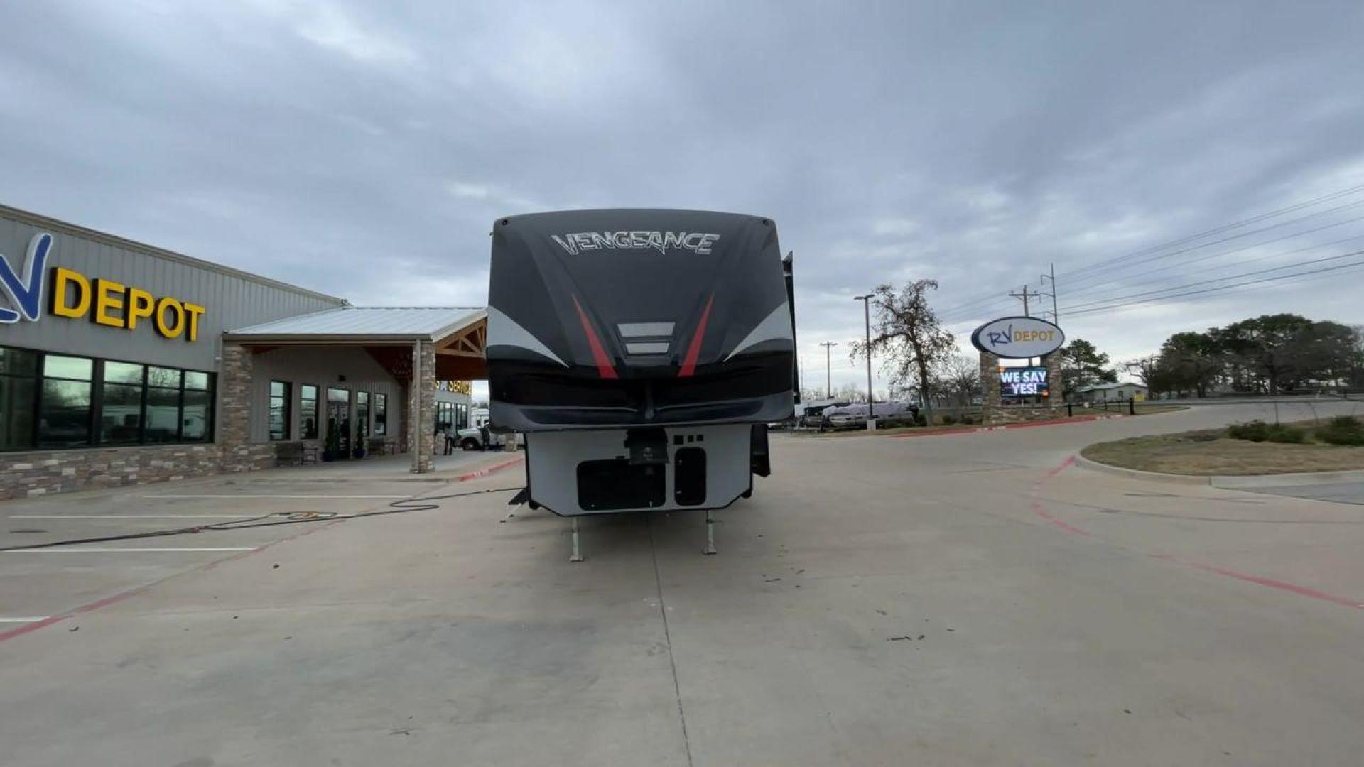 2015 GRAY FOREST RIVER VENGEANCE 320A (4X4FVGH28FY) , Length: 39.25 ft. | Dry Weight: 11,065 lbs. | Gross Weight: 14,697 lbs. | Slides: 3 transmission, located at 4319 N Main St, Cleburne, TX, 76033, (817) 678-5133, 32.385960, -97.391212 - Take advantage of the 2015 Forest River Vengeance 320A toy hauler and unleash your sense of adventure. For individuals who like the freedom to take their favorite toys with them on the road and the excitement of the open road, this sturdy and expertly built RV is ideal. This toy hauler has a dime - Photo#4