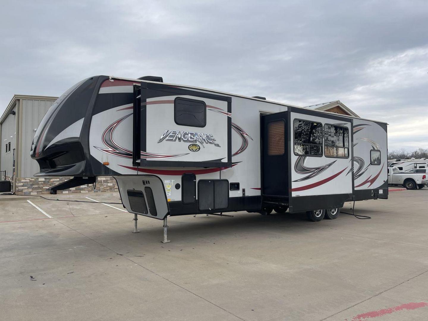 2015 GRAY FOREST RIVER VENGEANCE 320A (4X4FVGH28FY) , Length: 39.25 ft. | Dry Weight: 11,065 lbs. | Gross Weight: 14,697 lbs. | Slides: 3 transmission, located at 4319 N Main St, Cleburne, TX, 76033, (817) 678-5133, 32.385960, -97.391212 - Take advantage of the 2015 Forest River Vengeance 320A toy hauler and unleash your sense of adventure. For individuals who like the freedom to take their favorite toys with them on the road and the excitement of the open road, this sturdy and expertly built RV is ideal. This toy hauler has a dime - Photo#24