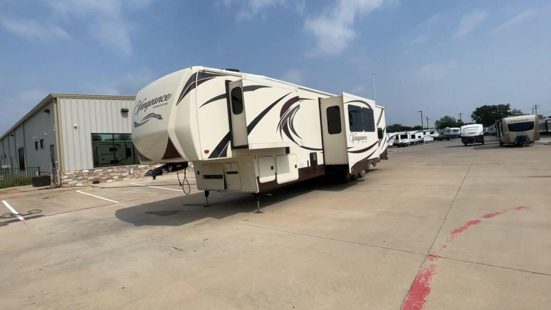 2015 TAN FOREST RIVER VENGEANCE 39B12 - (4X4FVGR32FR) , Length: 42.83 ft. | Dry Weight: 14,270 lbs. | Gross Weight: 17,500 lbs. | Slides: 3 transmission, located at 4319 N Main St, Cleburne, TX, 76033, (817) 678-5133, 32.385960, -97.391212 - This beautiful trailer is 42.83 feet long, so it has plenty of space for all of your camping stuff and everyday things. With a dry weight of 14,270 pounds and a gross weight of 17,500 pounds, it's just the right amount of strong and handy for your trips. When you go inside, you'll find a luxury spac - Photo#5