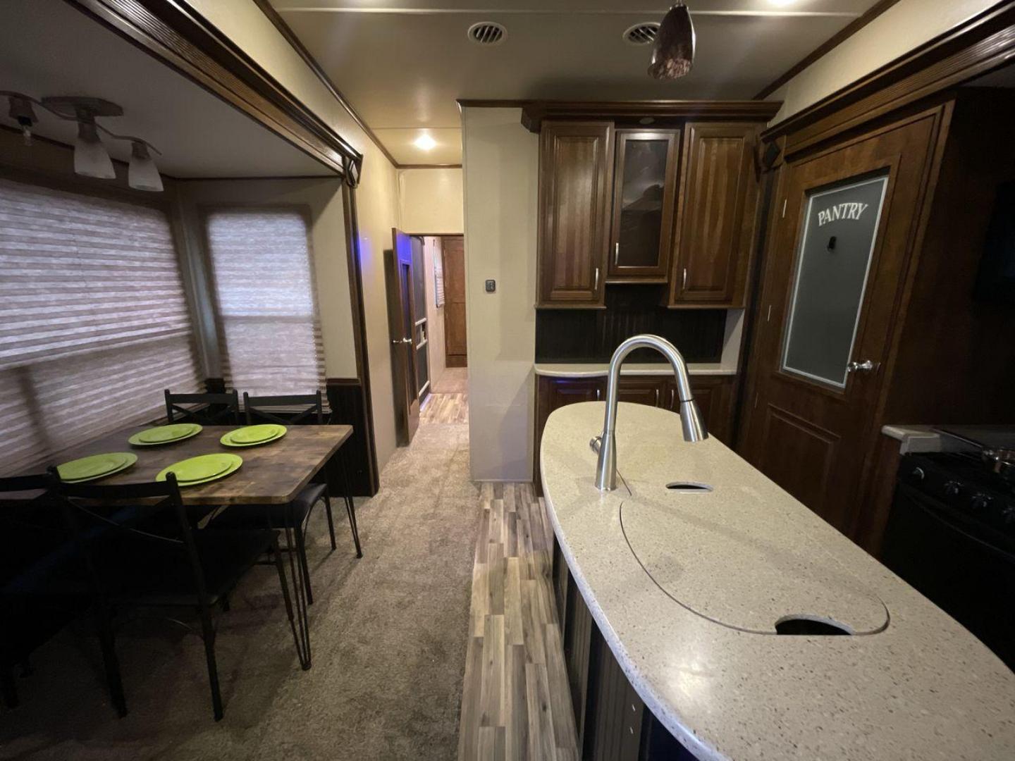 2015 BEIGE GRAND DESIGN SOLITUDE 379FL (573FS4325F1) , Length: 42.5 ft. | Dry Weight: 13,800 lbs. | Gross Weight: 16,000 lbs. | Slides: 5 transmission, located at 4319 N Main St, Cleburne, TX, 76033, (817) 678-5133, 32.385960, -97.391212 - This 2015 GRSL Solitude 379 fifth wheel measures just over 42' in length. It is a dual axle and aluminum wheel setup with a GCWR of 16,000 lbs and a carrying capacity of 2,200 lbs. With five slides, this fifth wheel is spacious and comfortable! The Solitude's exterior is made from fiberglass, finish - Photo#12