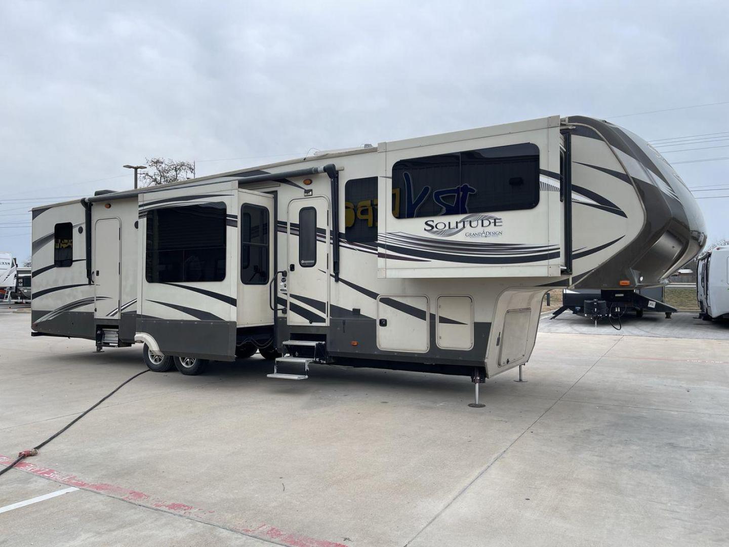 2015 BEIGE GRAND DESIGN SOLITUDE 379FL (573FS4325F1) , Length: 42.5 ft. | Dry Weight: 13,800 lbs. | Gross Weight: 16,000 lbs. | Slides: 5 transmission, located at 4319 N Main St, Cleburne, TX, 76033, (817) 678-5133, 32.385960, -97.391212 - This 2015 GRSL Solitude 379 fifth wheel measures just over 42' in length. It is a dual axle and aluminum wheel setup with a GCWR of 16,000 lbs and a carrying capacity of 2,200 lbs. With five slides, this fifth wheel is spacious and comfortable! The Solitude's exterior is made from fiberglass, finish - Photo#22