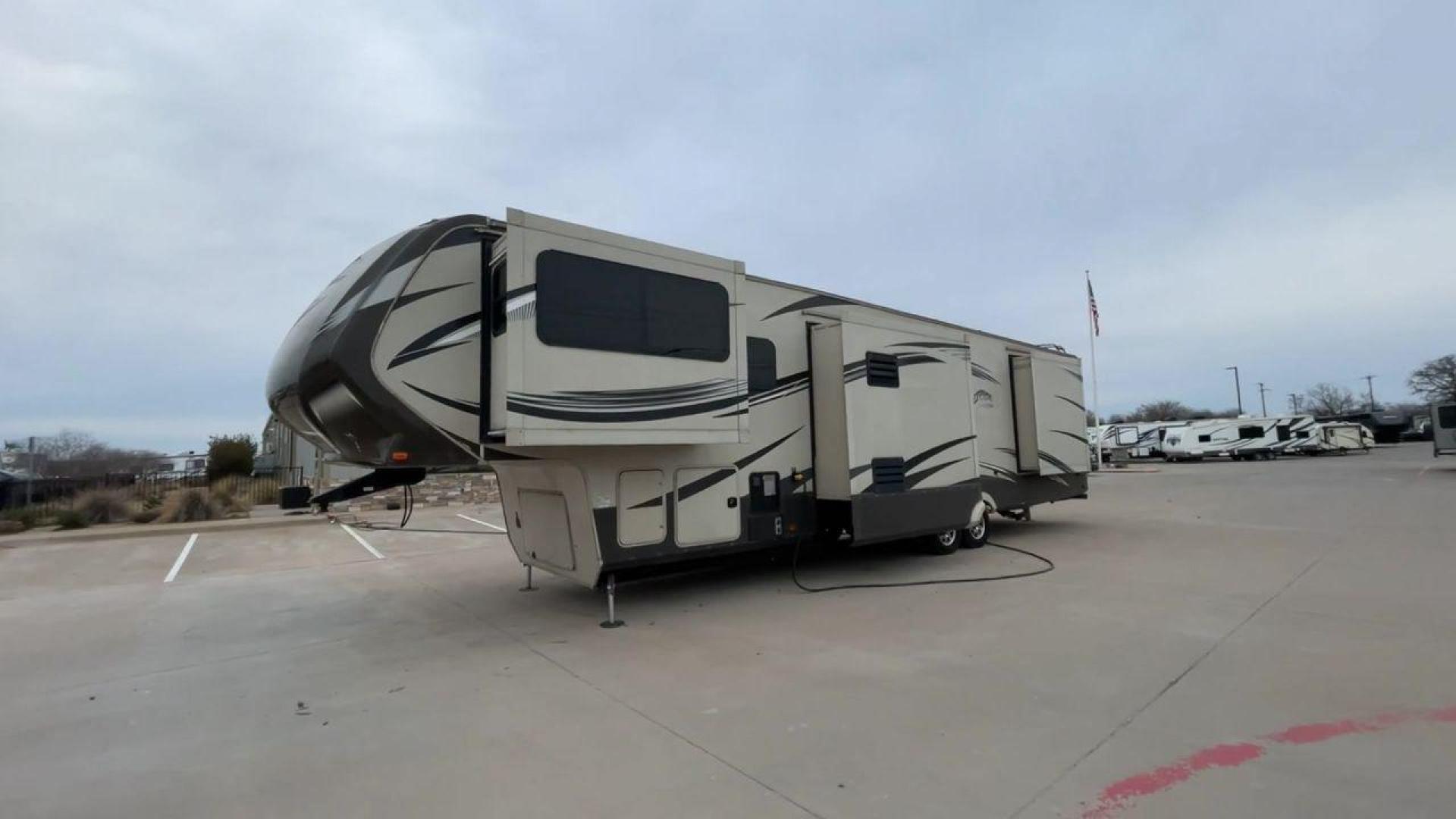 2015 BEIGE GRAND DESIGN SOLITUDE 379FL (573FS4325F1) , Length: 42.5 ft. | Dry Weight: 13,800 lbs. | Gross Weight: 16,000 lbs. | Slides: 5 transmission, located at 4319 N Main St, Cleburne, TX, 76033, (817) 678-5133, 32.385960, -97.391212 - This 2015 GRSL Solitude 379 fifth wheel measures just over 42' in length. It is a dual axle and aluminum wheel setup with a GCWR of 16,000 lbs and a carrying capacity of 2,200 lbs. With five slides, this fifth wheel is spacious and comfortable! The Solitude's exterior is made from fiberglass, finish - Photo#5