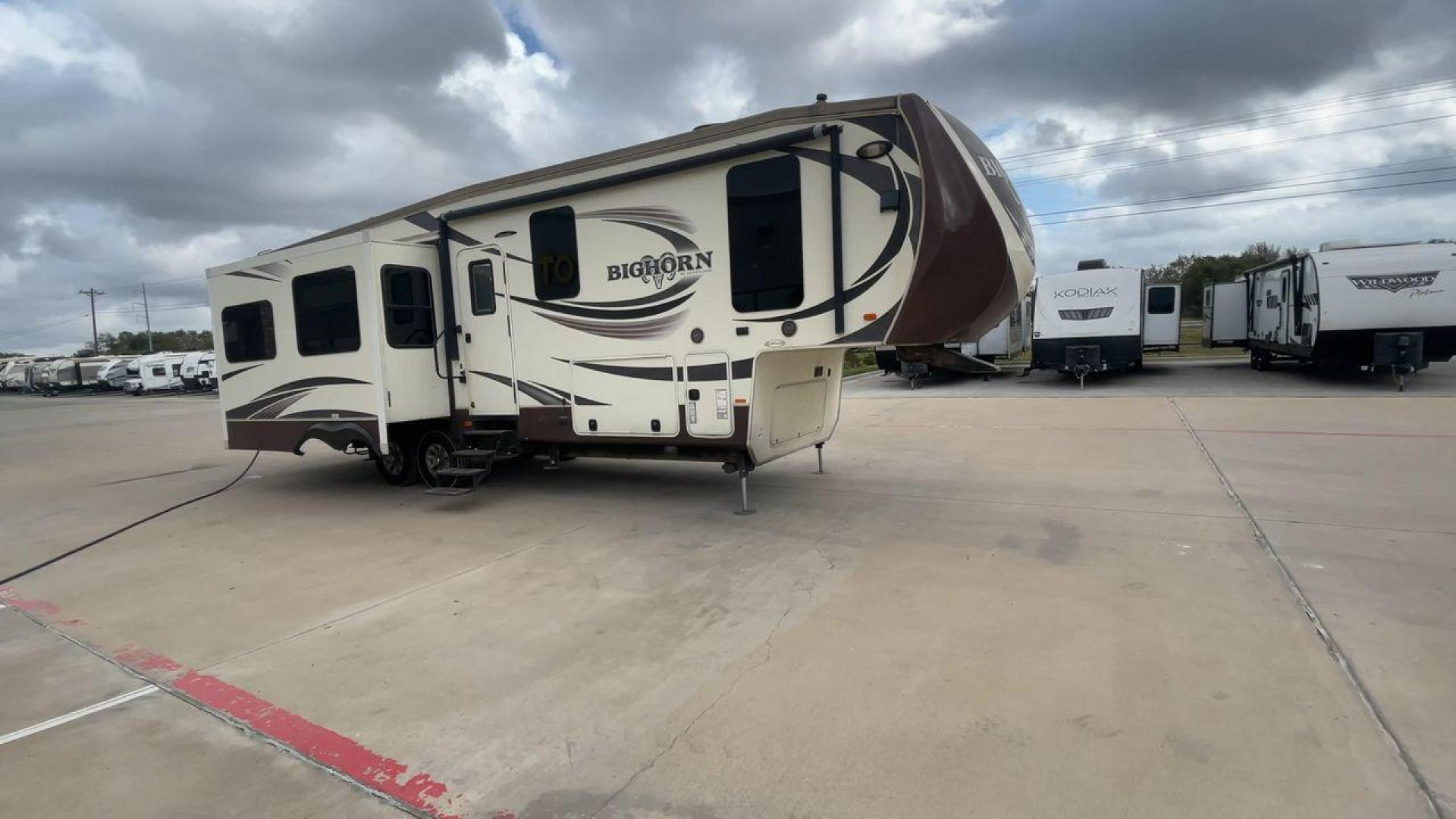 2015 HEARTLAND BIGHORN 3270RS (5SFBG3521FE) , Length: 36.6 ft. | Gross Weight: 15,500 lbs. | Slides: 3 transmission, located at 4319 N Main St, Cleburne, TX, 76033, (817) 678-5133, 32.385960, -97.391212 - The 2015 Heartland Bighorn 3270RS is a luxurious fifth wheel designed for comfort and quality, ideal for couples or small families seeking an upscale, spacious RV with residential-style amenities. This model is perfect for extended stays, featuring high-end finishes and an open floor plan. The dimen - Photo#3