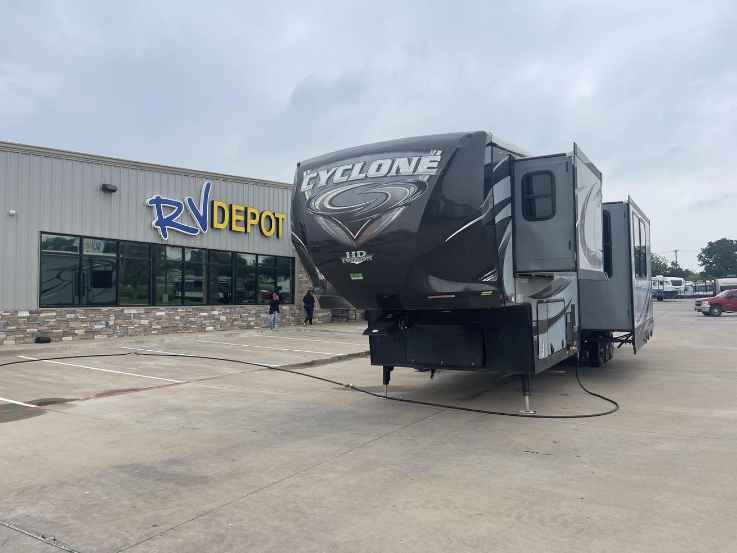 2015 GRAY HEARTLAND CYCLONE 4200 (5SFCG4430FE) , Length: 44 ft | Dry Weight: 15,725 lbs. | Gross Weight: 20,000 lbs. | Slides: 2 transmission, located at 4319 N Main St, Cleburne, TX, 76033, (817) 678-5133, 32.385960, -97.391212 - Embark on an exciting journey with the 2015 Heartland Cyclone 4200 Toy Hauler, a cutting-edge RV built to cater to your living needs while also allowing you to bring along your beloved toys. This 44-foot marvel features a toy hauler floorplan, combining functionality with luxury for the ultimate rec - Photo#0