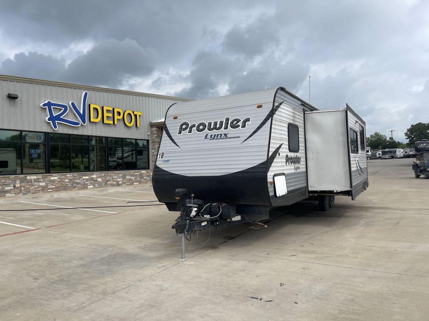 2015 HEARTLAND PROWLER 30LX (5SFPB3328FE) , Length: 33.9 ft | Dry Weight: 6,720 lbs | Gross Weight: 9,000 lbs | Slides: 1 transmission, located at 4319 N Main St, Cleburne, TX, 76033, (817) 678-5133, 32.385960, -97.391212 - Experience both comfort and adventure with the 2015 Heartland Prowler 30LX travel trailer. This trailer, measuring 33.9 feet long and having a single slide, provides plenty of space for your family and friends to enjoy the great outdoors. With a dry weight of 6,720 pounds and a gross weight of 9,000 - Photo#0