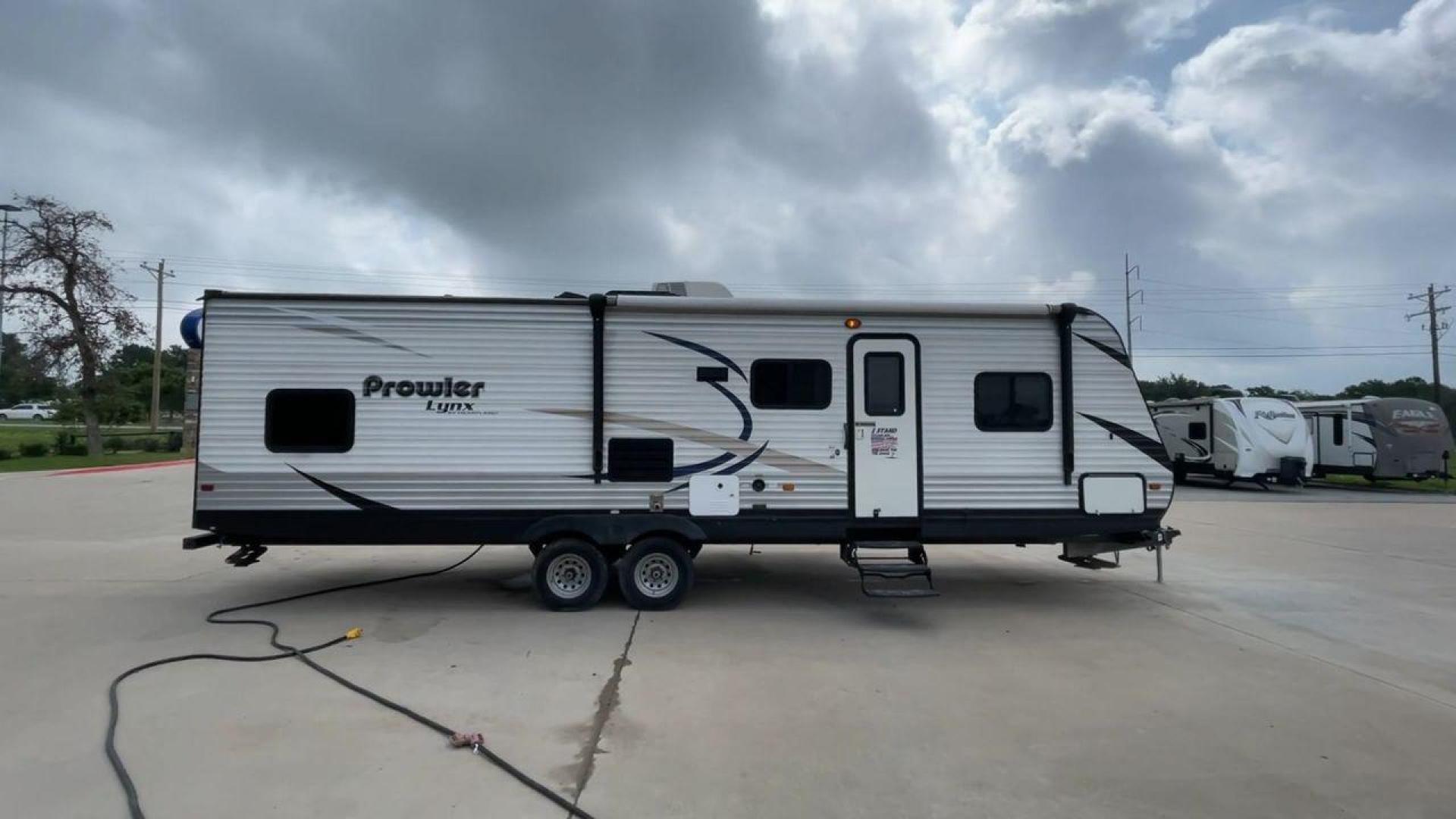 2015 HEARTLAND PROWLER 30LX (5SFPB3328FE) , Length: 33.9 ft | Dry Weight: 6,720 lbs | Gross Weight: 9,000 lbs | Slides: 1 transmission, located at 4319 N Main St, Cleburne, TX, 76033, (817) 678-5133, 32.385960, -97.391212 - Experience both comfort and adventure with the 2015 Heartland Prowler 30LX travel trailer. This trailer, measuring 33.9 feet long and having a single slide, provides plenty of space for your family and friends to enjoy the great outdoors. With a dry weight of 6,720 pounds and a gross weight of 9,000 - Photo#2