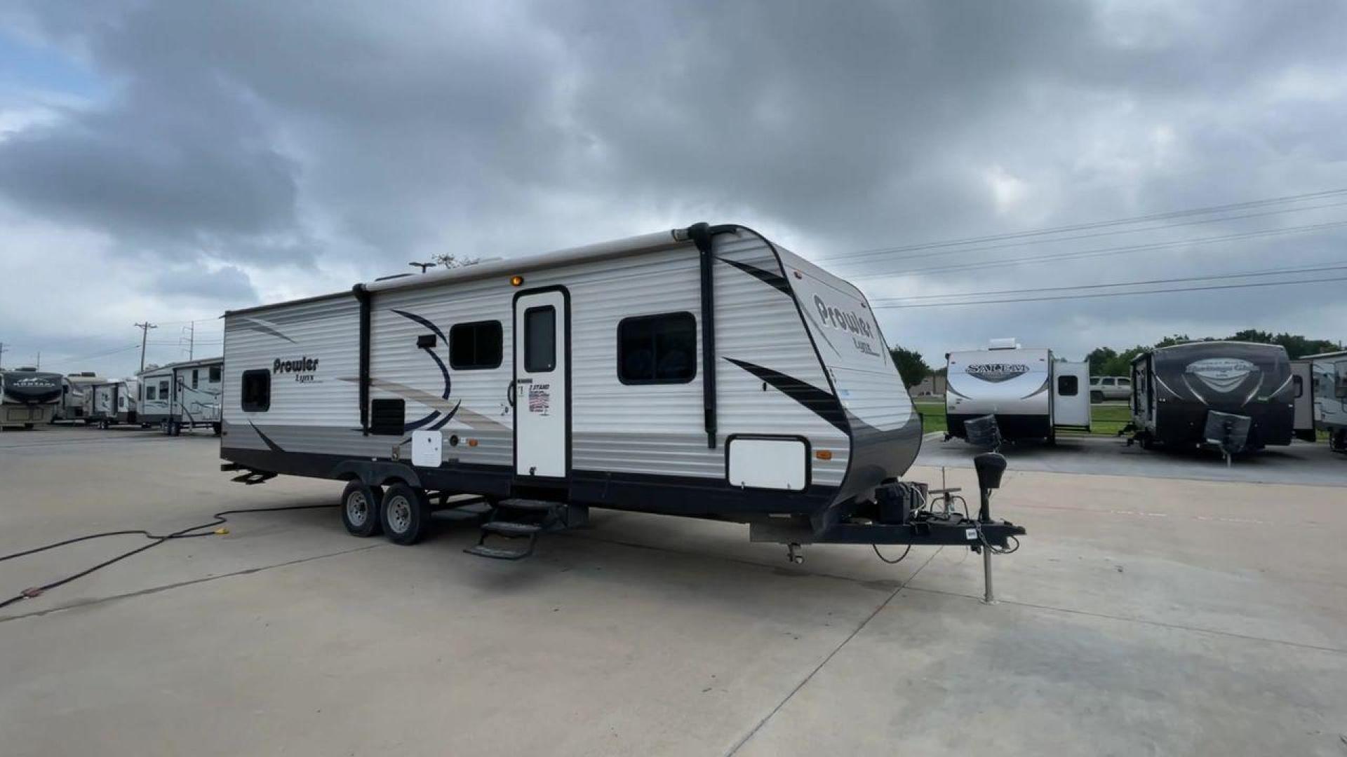 2015 HEARTLAND PROWLER 30LX (5SFPB3328FE) , Length: 33.9 ft | Dry Weight: 6,720 lbs | Gross Weight: 9,000 lbs | Slides: 1 transmission, located at 4319 N Main St, Cleburne, TX, 76033, (817) 678-5133, 32.385960, -97.391212 - Experience both comfort and adventure with the 2015 Heartland Prowler 30LX travel trailer. This trailer, measuring 33.9 feet long and having a single slide, provides plenty of space for your family and friends to enjoy the great outdoors. With a dry weight of 6,720 pounds and a gross weight of 9,000 - Photo#3