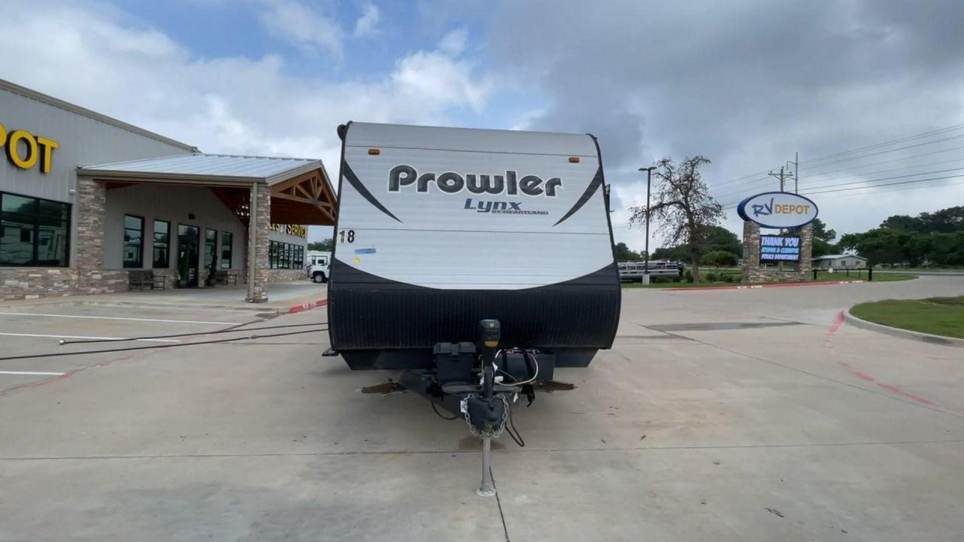 2015 HEARTLAND PROWLER 30LX (5SFPB3328FE) , Length: 33.9 ft | Dry Weight: 6,720 lbs | Gross Weight: 9,000 lbs | Slides: 1 transmission, located at 4319 N Main St, Cleburne, TX, 76033, (817) 678-5133, 32.385960, -97.391212 - Experience both comfort and adventure with the 2015 Heartland Prowler 30LX travel trailer. This trailer, measuring 33.9 feet long and having a single slide, provides plenty of space for your family and friends to enjoy the great outdoors. With a dry weight of 6,720 pounds and a gross weight of 9,000 - Photo#4