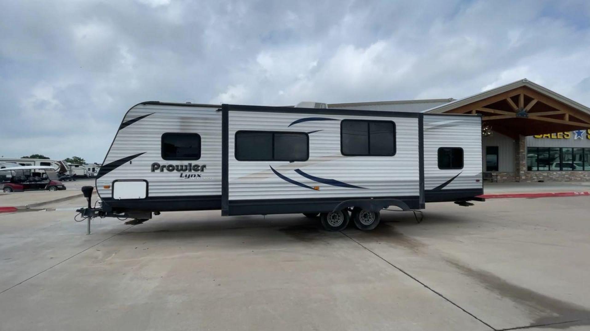 2015 HEARTLAND PROWLER 30LX (5SFPB3328FE) , Length: 33.9 ft | Dry Weight: 6,720 lbs | Gross Weight: 9,000 lbs | Slides: 1 transmission, located at 4319 N Main St, Cleburne, TX, 76033, (817) 678-5133, 32.385960, -97.391212 - Experience both comfort and adventure with the 2015 Heartland Prowler 30LX travel trailer. This trailer, measuring 33.9 feet long and having a single slide, provides plenty of space for your family and friends to enjoy the great outdoors. With a dry weight of 6,720 pounds and a gross weight of 9,000 - Photo#6