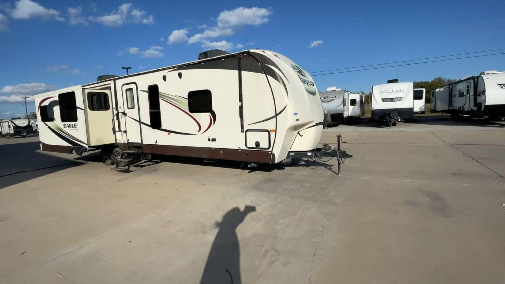 2015 BEIGE JAYCO EAGLE 338RETS - (1UJBJ0BU6F1) , Length: 39.2 ft. | Dry Weight: 8,710 lbs. | Gross Weight: 10,950 lbs. | Slides: 3 transmission, located at 4319 N Main St, Cleburne, TX, 76033, (817) 678-5133, 32.385960, -97.391212 - This 2015 Jayco Eagle 338RETS travel trailer measures just under 40' in length. It is a dual axle, aluminum wheel setup with a GVWR of 10,950 lbs and has a carrying capacity of 2,240 lbs. With three slides, this travel trailer is open and spacious!Constructed with an aluminum body and featuring fibe - Photo#3