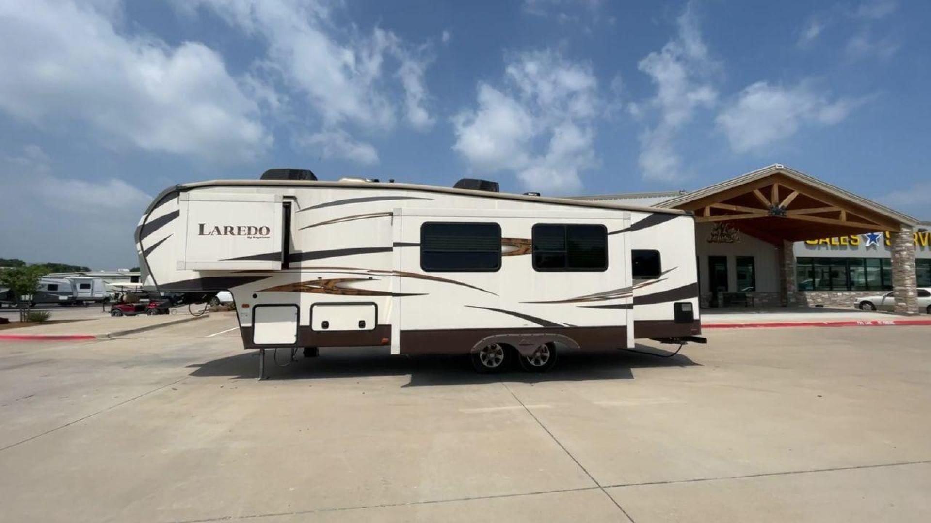 2015 WHITE KEYSTONE LAREDO 285SBH (4YDF28522FK) , Length: 33 ft. | Dry Weight: 7,880 lbs. | Gross Weight: 9,580 lbs. | Slides: 1 transmission, located at 4319 N Main St, Cleburne, TX, 76033, (817) 678-5133, 32.385960, -97.391212 - This 2015 Keystone Fifth Wheel measures 33 feet long and 8 feet wide with a dry weight of 7,880 lbs. It has a GVWR of 9,580 lbs and a hitch weight of 1,465 lbs. This model also comes with automatic heating and cooling rated at 30,000 and 13,500 BTUs respectively. The exterior of this unit is a base - Photo#7