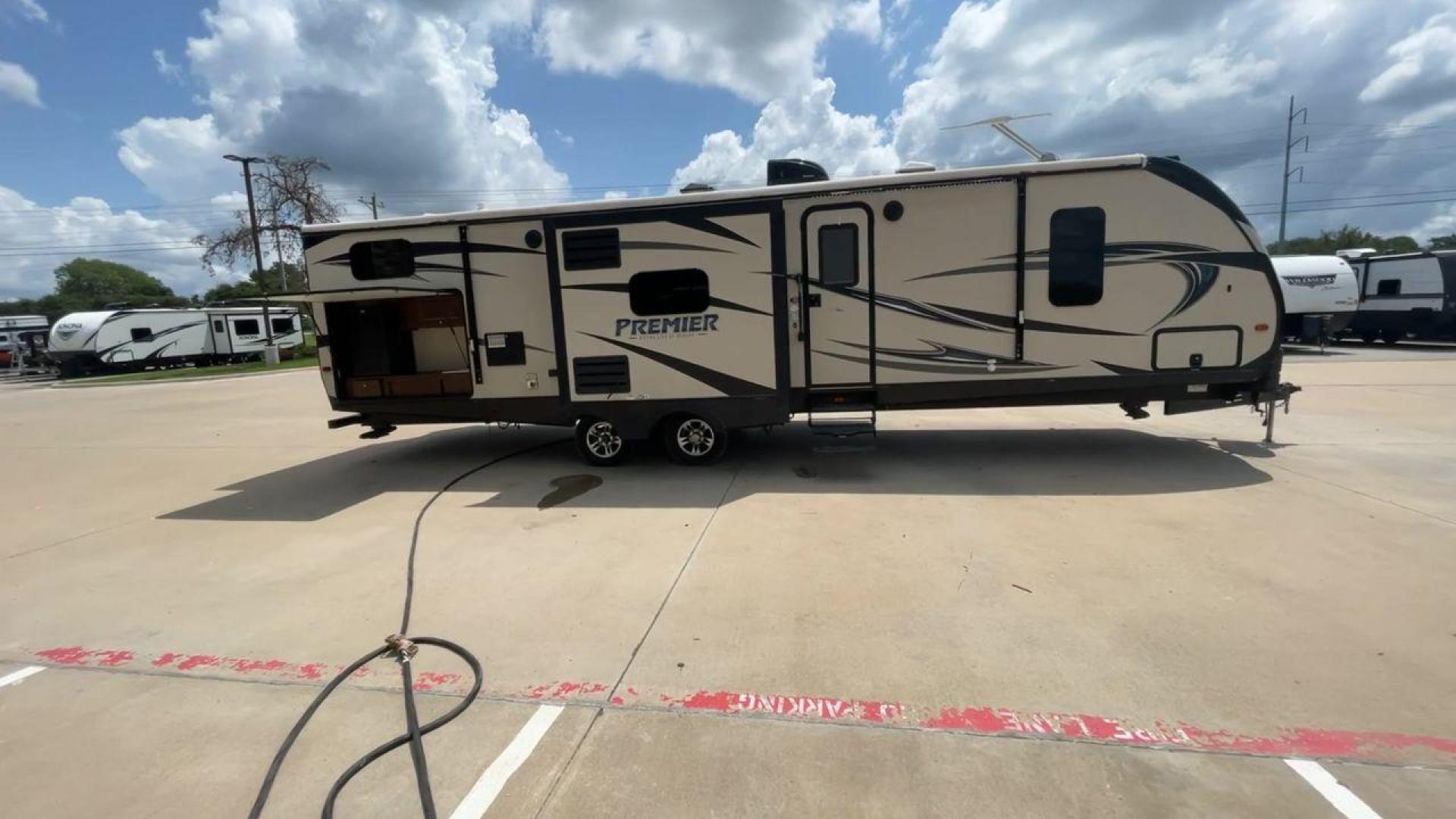 2015 TAN KEYSTONE PREMIER 34BHPR (4YDT34B25FD) , Length: 37 ft. | Dry Weight: 7,076 lbs. | Gross Weight: 8,800 lbs. | Slides: 3 transmission, located at 4319 N Main St, Cleburne, TX, 76033, (817) 678-5133, 32.385960, -97.391212 - Take a trip with more family members and friends in this remarkably spacious 2015 Keystone Premier 34BHPR! This travel trailer measures exactly 37 ft. in length and 10.92 ft. in height. It has a dry weight of 7,076 lbs. and a GVWR of 8,800 lbs. It highlights a rear bunk and an outside kitchen, ma - Photo#2