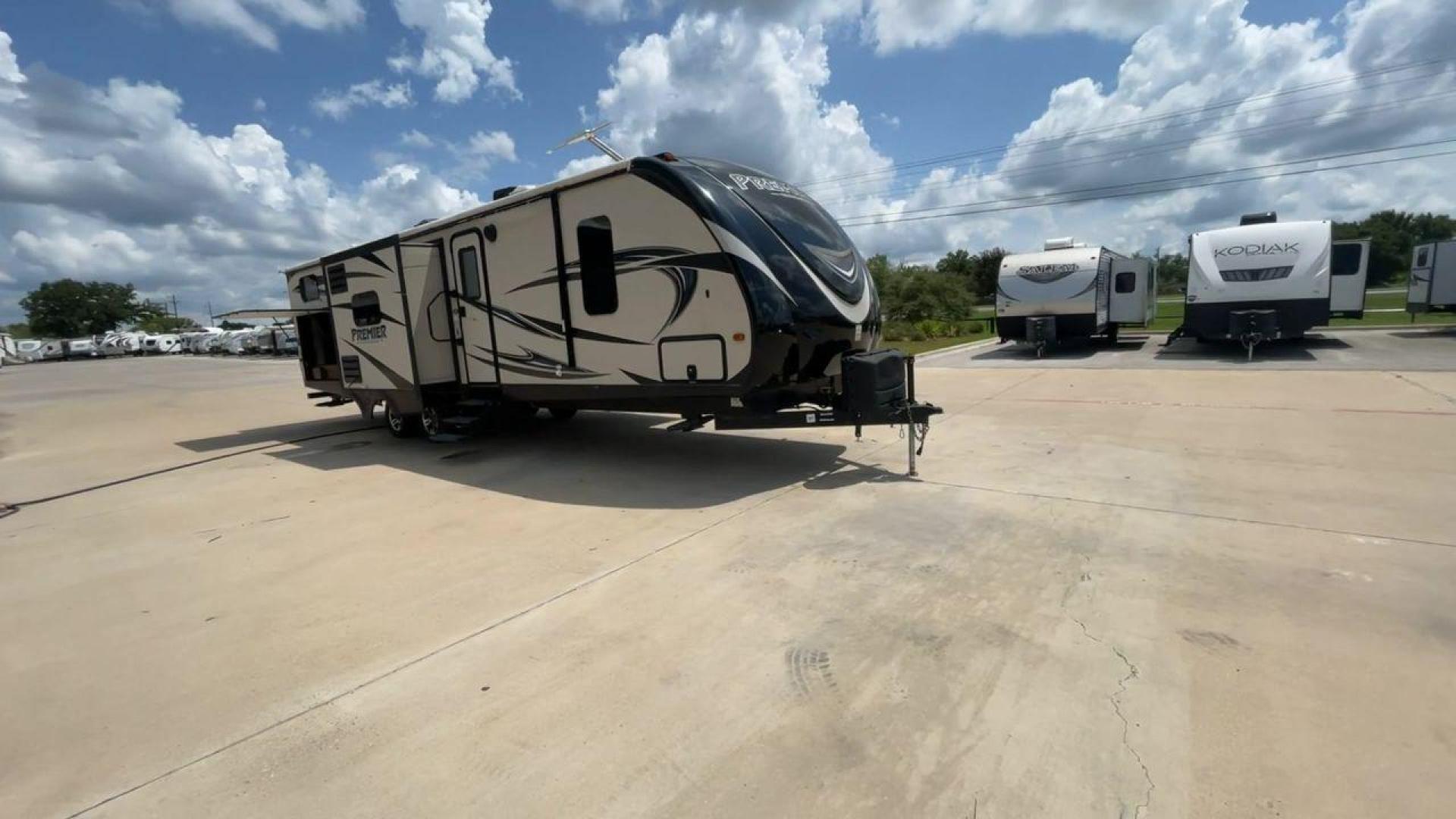 2015 TAN KEYSTONE PREMIER 34BHPR (4YDT34B25FD) , Length: 37 ft. | Dry Weight: 7,076 lbs. | Gross Weight: 8,800 lbs. | Slides: 3 transmission, located at 4319 N Main St, Cleburne, TX, 76033, (817) 678-5133, 32.385960, -97.391212 - Take a trip with more family members and friends in this remarkably spacious 2015 Keystone Premier 34BHPR! This travel trailer measures exactly 37 ft. in length and 10.92 ft. in height. It has a dry weight of 7,076 lbs. and a GVWR of 8,800 lbs. It highlights a rear bunk and an outside kitchen, ma - Photo#3