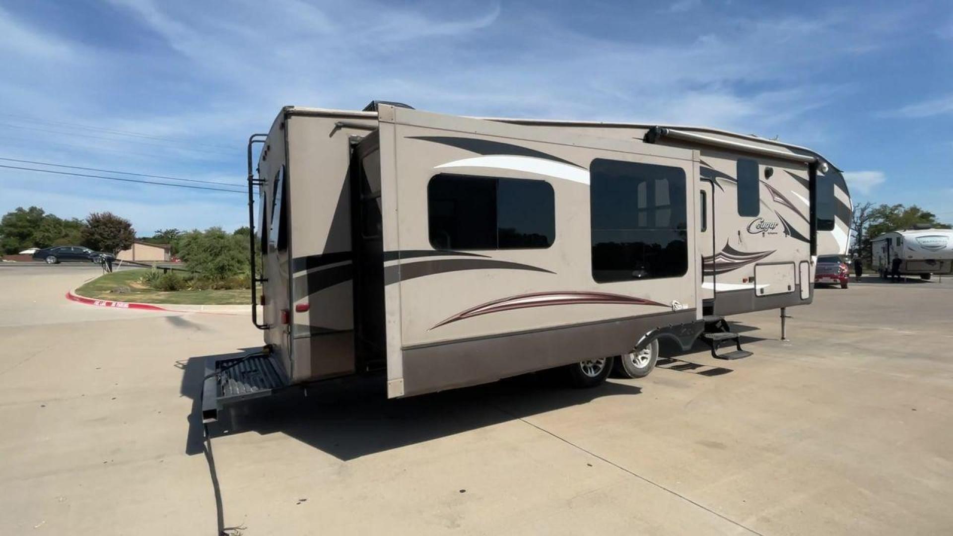 2015 KEYSTONE RV COUGAR 327RES (4YDF32729F2) , Length: 36.42 ft. | Dry Weight: 10,213 lbs. | Gross Weight: 12,135 lbs. | Slides: 3 transmission, located at 4319 N Main St, Cleburne, TX, 76033, (817) 678-5133, 32.385960, -97.391212 - Enjoy the abundant storage and space that comes with the 2015 Keystone Cougar 327RES! This fifth wheel measures 36.42 ft. in length and 12.25 ft. in height. It has a dry weight of 10,213 lbs. and a GVWR of 12,135 lbs. It also comes equipped with automatic heating and cooling rated at 30,000 and 1 - Photo#1