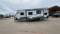 2015 WHITE KINGSPORT 277DDS - (1NL1GTM22F1) , Length: 31.17 ft. | Dry Weight: 6,620 lbs. | Slides: 1 transmission, located at 4319 N Main St, Cleburne, TX, 76033, (817) 678-5133, 32.385960, -97.391212 - This 2015 Kingsport 277DDS measures 31.17 ft. in length and 10.75 ft. in height. It has a dry weight of 6,620 lbs. with a payload capacity of 1,520 lbs. and a hitch weight of 958 lbs. It includes two doors, one slide, and one awning. This travel trailer offers sleeping space for up to 10 people w - Photo#6