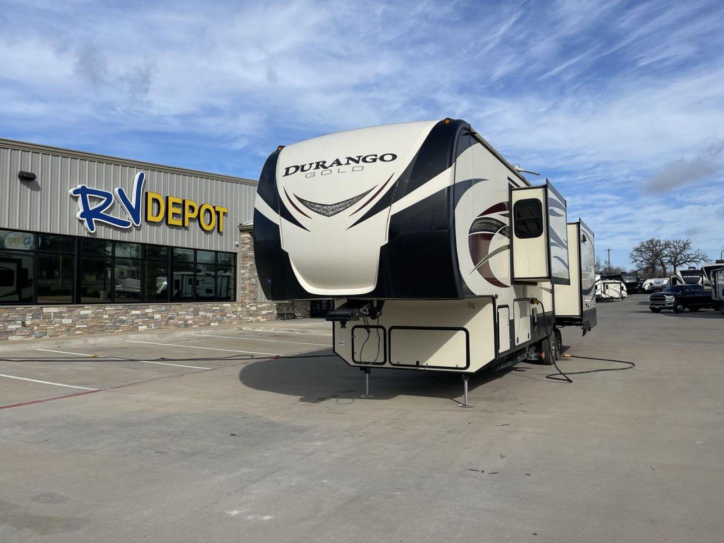 2015 TAN KZ DURANGO 370RLT (4EZFV3727F6) , Length: 39.5 ft. | Dry Weight: 11,686 lbs. | Gross Weight: 14,500 lbs. | Slides: 3 transmission, located at 4319 N Main St, Cleburne, TX, 76033, (817) 678-5133, 32.385960, -97.391212 - The 2017 KZ Durango 370RLT measures 39.5 ft. in length. It has a dry weight of 11,686 lbs. and a GVWR of 14,500 lbs. It is made of aluminum and fiberglass. It has three spacious slides and comes with an automatic heating and cooling rate of 35,000 and 15,000 BTUs, respectively. This model features a - Photo#0