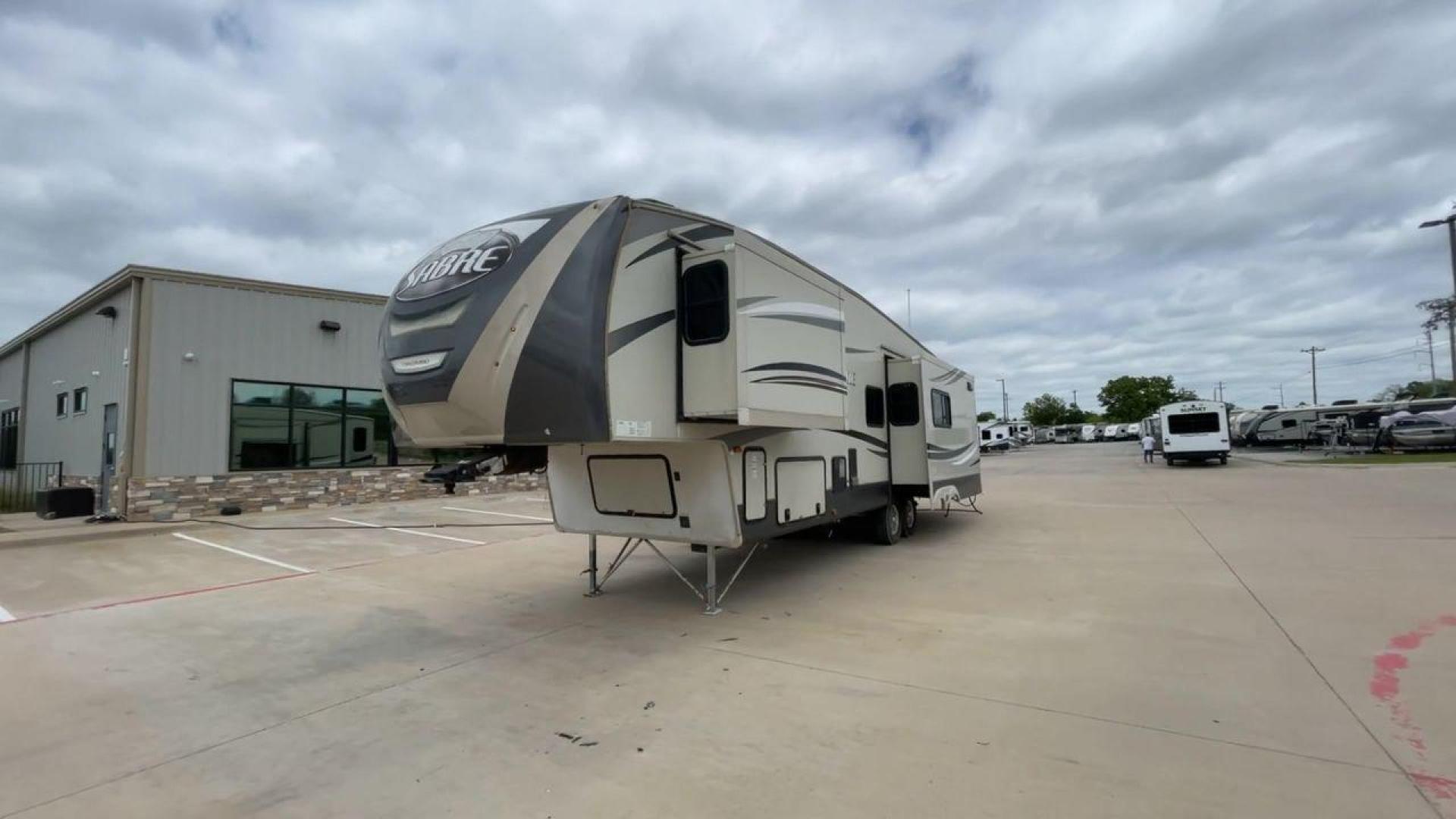 2015 TAN PALOMINO SABRE 34RDKS (4X4FSRK2XF3) , Length: 38.92 ft. | Dry Weight: 11,081 lbs. | Gross Weight: 13,950 lbs. | Slides: 4 transmission, located at 4319 N Main St, Cleburne, TX, 76033, (817) 678-5133, 32.385960, -97.391212 - This 2015 Sabre Fifth Wheel measures at just under 39 feet with a dry weight of 11,081 lbs. It has a GVWR of 13,950 lbs and a hitch weight of 2,205 lbs. This unit has a heater rated at 35,000 BTUs and a cooler rated at 13,500 BTUs meaning the temperature is always in your control. This model has a b - Photo#5