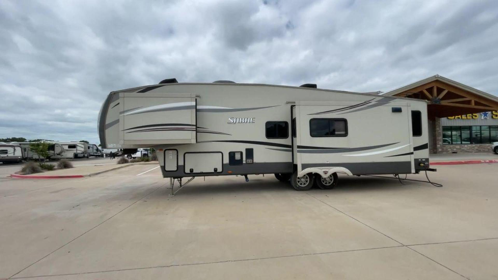 2015 TAN PALOMINO SABRE 34RDKS (4X4FSRK2XF3) , Length: 38.92 ft. | Dry Weight: 11,081 lbs. | Gross Weight: 13,950 lbs. | Slides: 4 transmission, located at 4319 N Main St, Cleburne, TX, 76033, (817) 678-5133, 32.385960, -97.391212 - This 2015 Sabre Fifth Wheel measures at just under 39 feet with a dry weight of 11,081 lbs. It has a GVWR of 13,950 lbs and a hitch weight of 2,205 lbs. This unit has a heater rated at 35,000 BTUs and a cooler rated at 13,500 BTUs meaning the temperature is always in your control. This model has a b - Photo#6