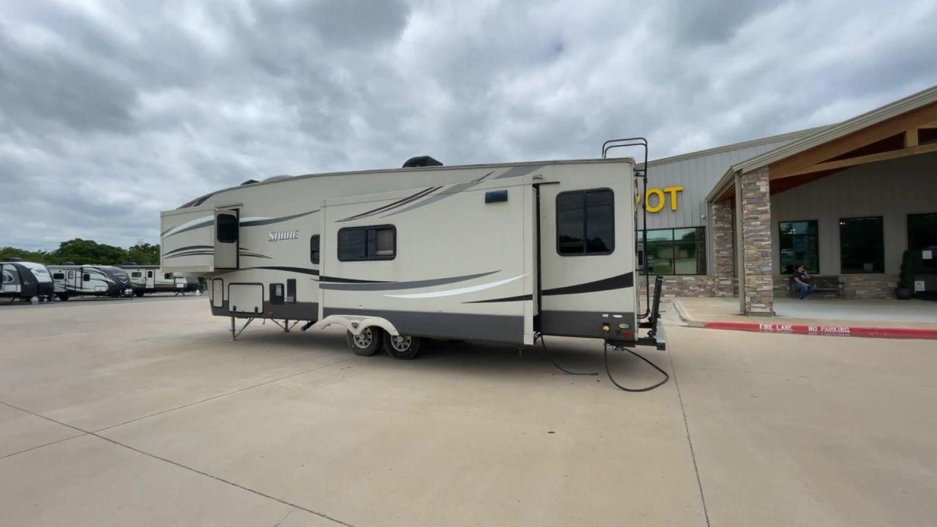 2015 TAN PALOMINO SABRE 34RDKS (4X4FSRK2XF3) , Length: 38.92 ft. | Dry Weight: 11,081 lbs. | Gross Weight: 13,950 lbs. | Slides: 4 transmission, located at 4319 N Main St, Cleburne, TX, 76033, (817) 678-5133, 32.385960, -97.391212 - This 2015 Sabre Fifth Wheel measures at just under 39 feet with a dry weight of 11,081 lbs. It has a GVWR of 13,950 lbs and a hitch weight of 2,205 lbs. This unit has a heater rated at 35,000 BTUs and a cooler rated at 13,500 BTUs meaning the temperature is always in your control. This model has a b - Photo#7