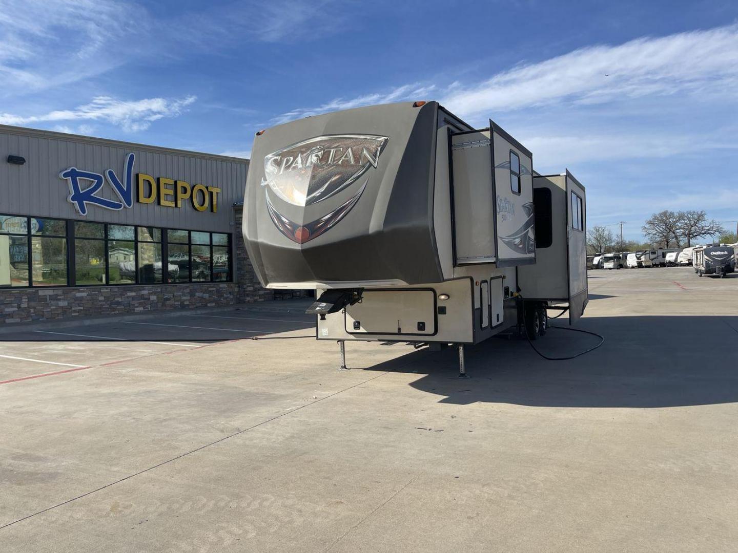 2015 WHITE SPARTAN 3210 (5ZT3STXBXFG) , located at 4319 N Main St, Cleburne, TX, 76033, (817) 678-5133, 32.385960, -97.391212 - Here are additional factors highlighting why owning this RV is a superb choice. (1) The 2015 Spartan 3210 Toy Hauler has Aluminum-framed construction with vacuum-bonded laminated sidewalls (2) It features Electric patio awning, Pass-through storage compartments and Spare tire with lockable compa - Photo#0