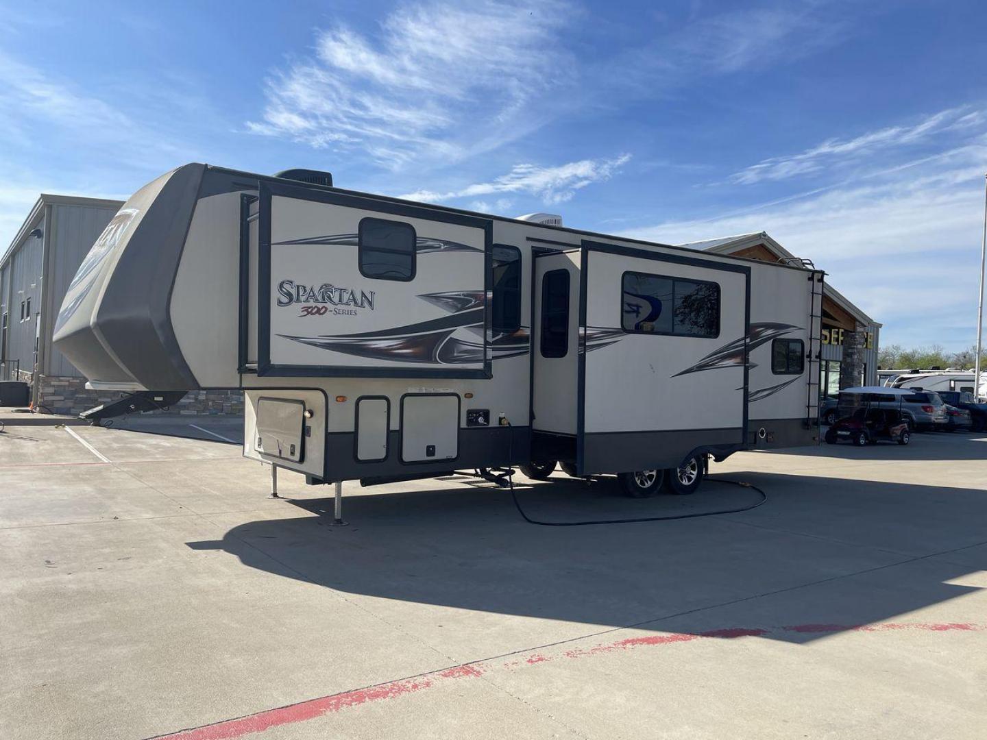 2015 WHITE SPARTAN 3210 (5ZT3STXBXFG) , located at 4319 N Main St, Cleburne, TX, 76033, (817) 678-5133, 32.385960, -97.391212 - Here are additional factors highlighting why owning this RV is a superb choice. (1) The 2015 Spartan 3210 Toy Hauler has Aluminum-framed construction with vacuum-bonded laminated sidewalls (2) It features Electric patio awning, Pass-through storage compartments and Spare tire with lockable compa - Photo#24