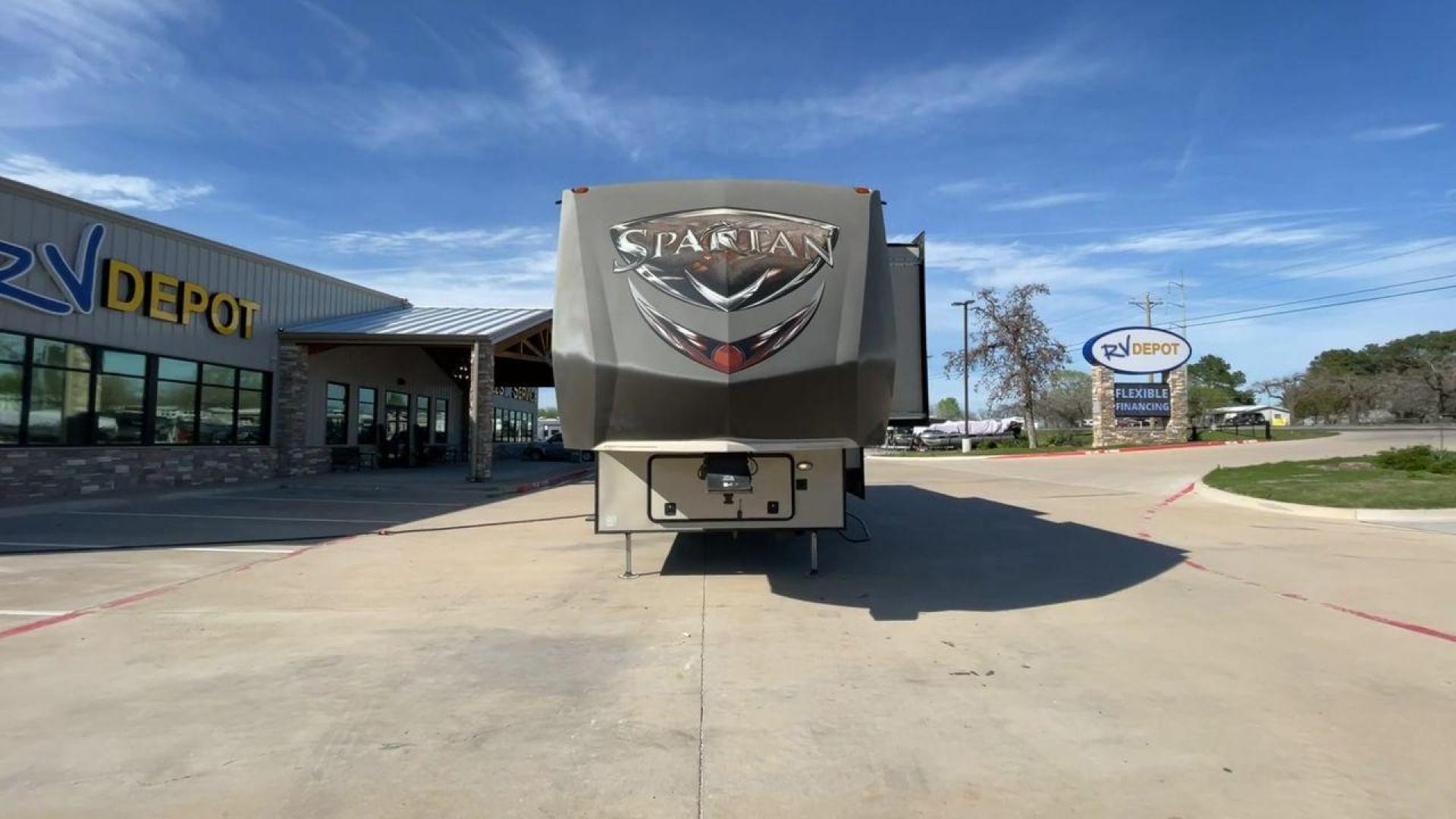 2015 WHITE SPARTAN 3210 (5ZT3STXBXFG) , located at 4319 N Main St, Cleburne, TX, 76033, (817) 678-5133, 32.385960, -97.391212 - Here are additional factors highlighting why owning this RV is a superb choice. (1) The 2015 Spartan 3210 Toy Hauler has Aluminum-framed construction with vacuum-bonded laminated sidewalls (2) It features Electric patio awning, Pass-through storage compartments and Spare tire with lockable compa - Photo#4