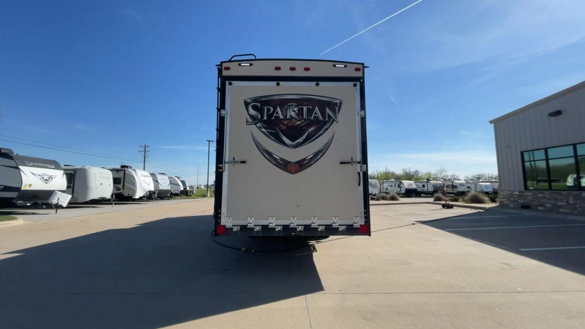 2015 WHITE SPARTAN 3210 (5ZT3STXBXFG) , located at 4319 N Main St, Cleburne, TX, 76033, (817) 678-5133, 32.385960, -97.391212 - Here are additional factors highlighting why owning this RV is a superb choice. (1) The 2015 Spartan 3210 Toy Hauler has Aluminum-framed construction with vacuum-bonded laminated sidewalls (2) It features Electric patio awning, Pass-through storage compartments and Spare tire with lockable compa - Photo#8