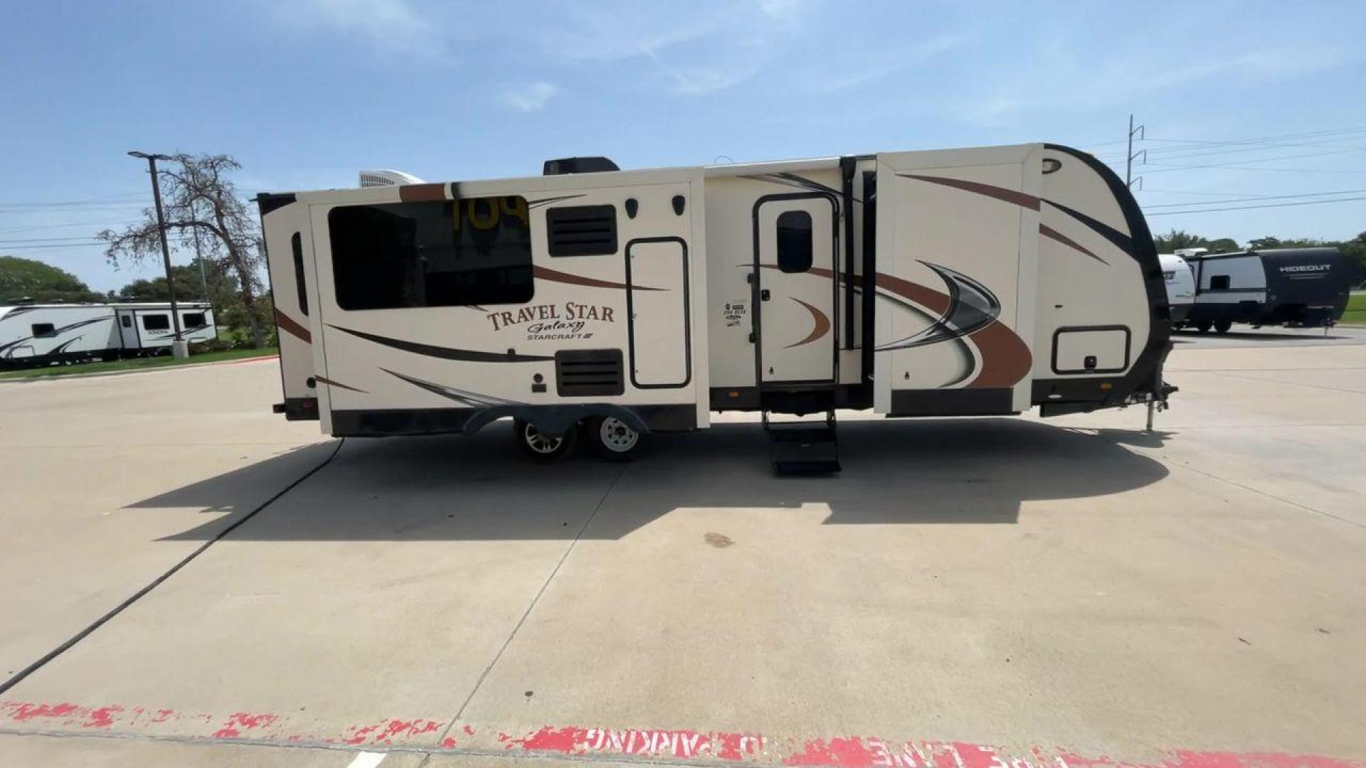 2015 TAN STARCRAFT TRAVEL STAR 294RESA (1SABS0BR5F2) , Length: 34 ft. | Dry Weight: 7,230 lbs. | Gross Weight: 9,250 lbs. | Slides: 3 transmission, located at 4319 N Main St, Cleburne, TX, 76033, (817) 678-5133, 32.385960, -97.391212 - This 2015 Travel Star 294RESA is a dual-axle steel wheel setup measuring 34 ft. in length and 11.38 ft. in height. It has a dry weight of 7,230 lbs. and a GVWR of 9,250 lbs. It also has a hitch weight of 865 lbs. This travel trailer includes three slides as well as one awning. The interior features - Photo#2