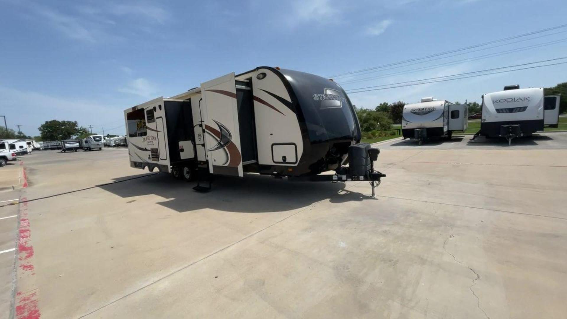 2015 TAN STARCRAFT TRAVEL STAR 294RESA (1SABS0BR5F2) , Length: 34 ft. | Dry Weight: 7,230 lbs. | Gross Weight: 9,250 lbs. | Slides: 3 transmission, located at 4319 N Main St, Cleburne, TX, 76033, (817) 678-5133, 32.385960, -97.391212 - This 2015 Travel Star 294RESA is a dual-axle steel wheel setup measuring 34 ft. in length and 11.38 ft. in height. It has a dry weight of 7,230 lbs. and a GVWR of 9,250 lbs. It also has a hitch weight of 865 lbs. This travel trailer includes three slides as well as one awning. The interior features - Photo#3