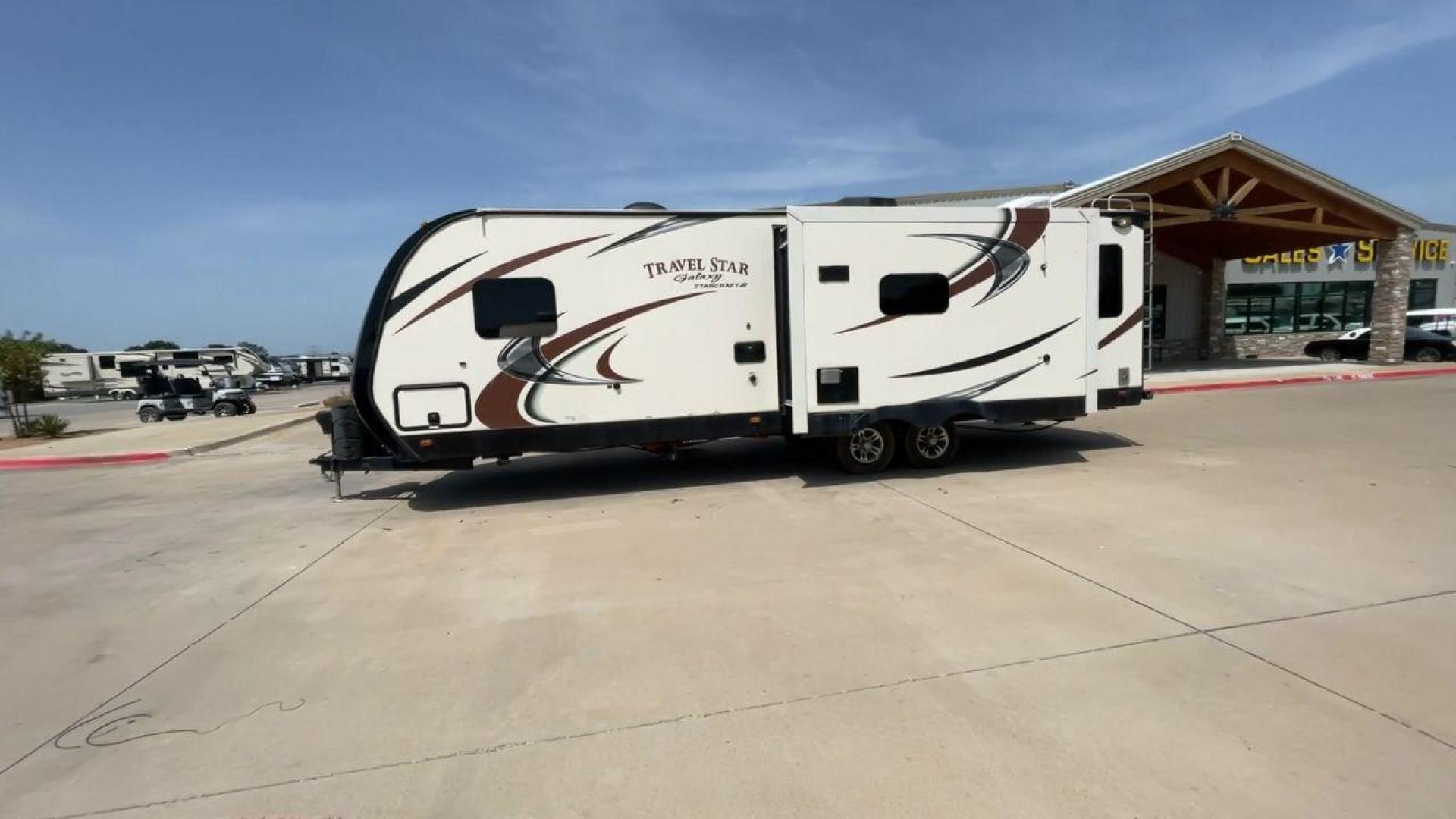 2015 TAN STARCRAFT TRAVEL STAR 294RESA (1SABS0BR5F2) , Length: 34 ft. | Dry Weight: 7,230 lbs. | Gross Weight: 9,250 lbs. | Slides: 3 transmission, located at 4319 N Main St, Cleburne, TX, 76033, (817) 678-5133, 32.385960, -97.391212 - This 2015 Travel Star 294RESA is a dual-axle steel wheel setup measuring 34 ft. in length and 11.38 ft. in height. It has a dry weight of 7,230 lbs. and a GVWR of 9,250 lbs. It also has a hitch weight of 865 lbs. This travel trailer includes three slides as well as one awning. The interior features - Photo#6