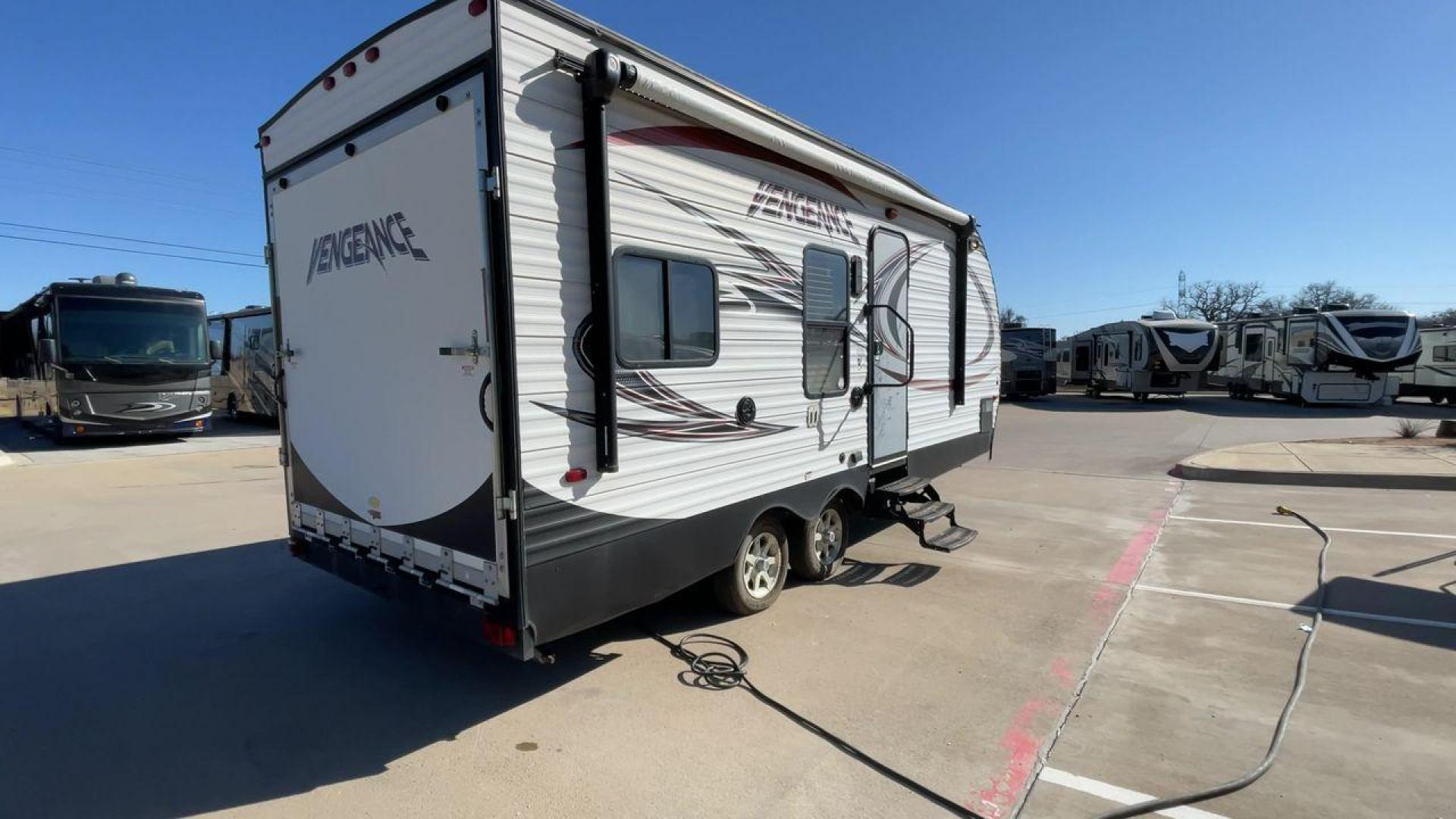 2015 WHITE VENGEANCE 19V (4X4TVGU27FY) , Length: 25 ft. | Dry Weight: 5,166 lbs. | Gross Weight: 7,945 lbs. transmission, located at 4319 N Main St, Cleburne, TX, 76033, (817) 678-5133, 32.385960, -97.391212 - The 2015 Forest River Vengeance 19V is a compact and inviting travel trailer that brings simplicity and comfort to your adventures. With a length of ~25 feet and a width of 8 feet, this trailer has a manageable size, making it easy to tow with a compatible vehicle. The sleeping capacity generously a - Photo#1