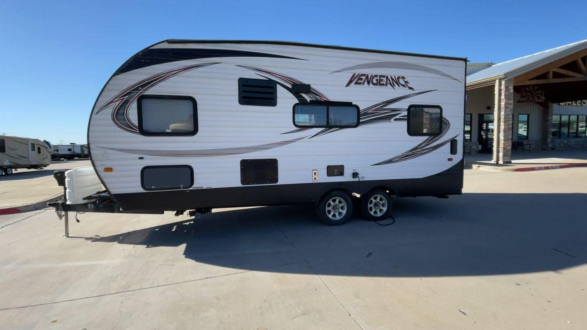 2015 WHITE VENGEANCE 19V (4X4TVGU27FY) , Length: 25 ft. | Dry Weight: 5,166 lbs. | Gross Weight: 7,945 lbs. transmission, located at 4319 N Main St, Cleburne, TX, 76033, (817) 678-5133, 32.385960, -97.391212 - The 2015 Forest River Vengeance 19V is a compact and inviting travel trailer that brings simplicity and comfort to your adventures. With a length of ~25 feet and a width of 8 feet, this trailer has a manageable size, making it easy to tow with a compatible vehicle. The sleeping capacity generously a - Photo#6