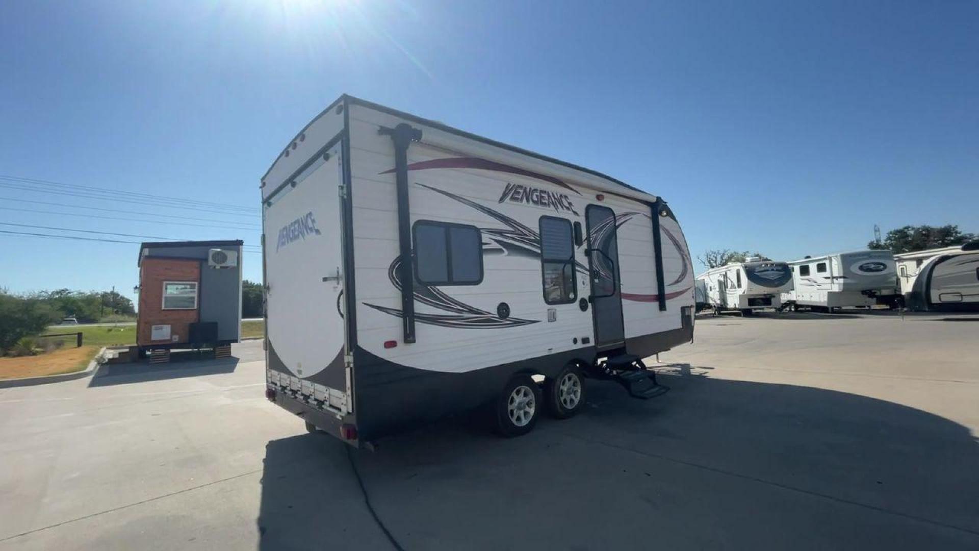 2015 WHITE VENGEANCE 19V (4X4TVGU27FY) , Length: 25 ft. | Dry Weight: 5,166 lbs. | Gross Weight: 7,945 lbs. transmission, located at 4319 N Main St, Cleburne, TX, 76033, (817) 678-5133, 32.385960, -97.391212 - The 2015 Forest River Vengeance 19V is a compact and inviting travel trailer that brings simplicity and comfort to your adventures. With a length of ~25 feet and a width of 8 feet, this trailer has a manageable size, making it easy to tow with a compatible vehicle. The sleeping capacity generously a - Photo#1