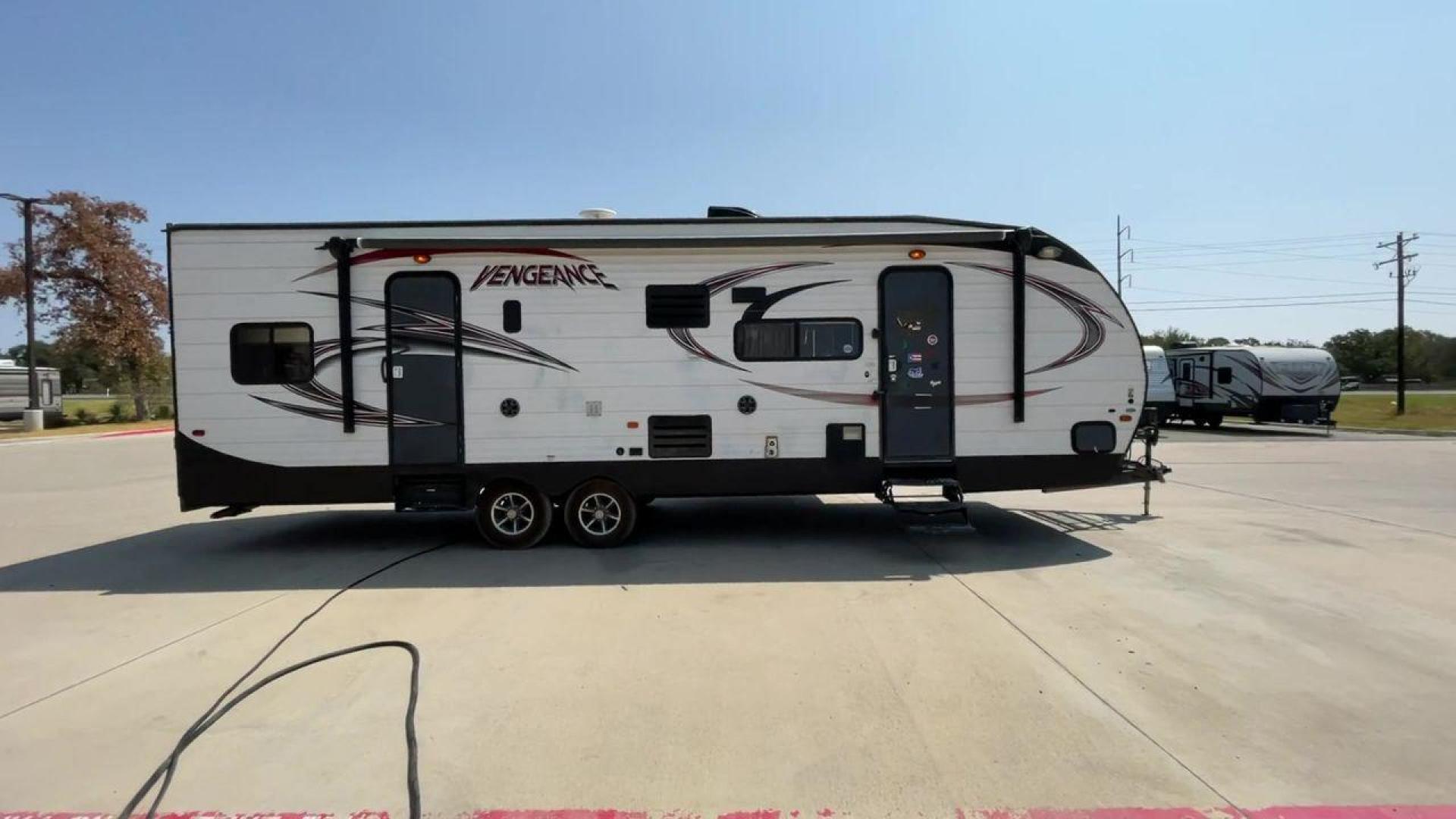 2015 WHITE VENGEANCE SU 29V (4X4TVGE24FY) , Length: 34.5 ft. | Dry Weight: 7,618 lbs. | Gross Weight: 9,985 lbs. | Slides: 1 transmission, located at 4319 N Main St, Cleburne, TX, 76033, (817) 678-5133, 32.385960, -97.391212 - The 2015 Vengeance SU 29V is a versatile and spacious toy hauler, ideal for outdoor enthusiasts who crave adventure. With a length of 34.5 feet and a dry weight of 7,618 pounds, this travel trailer provides generous storage space while ensuring your comfort is not compromised. With a single slide, t - Photo#2