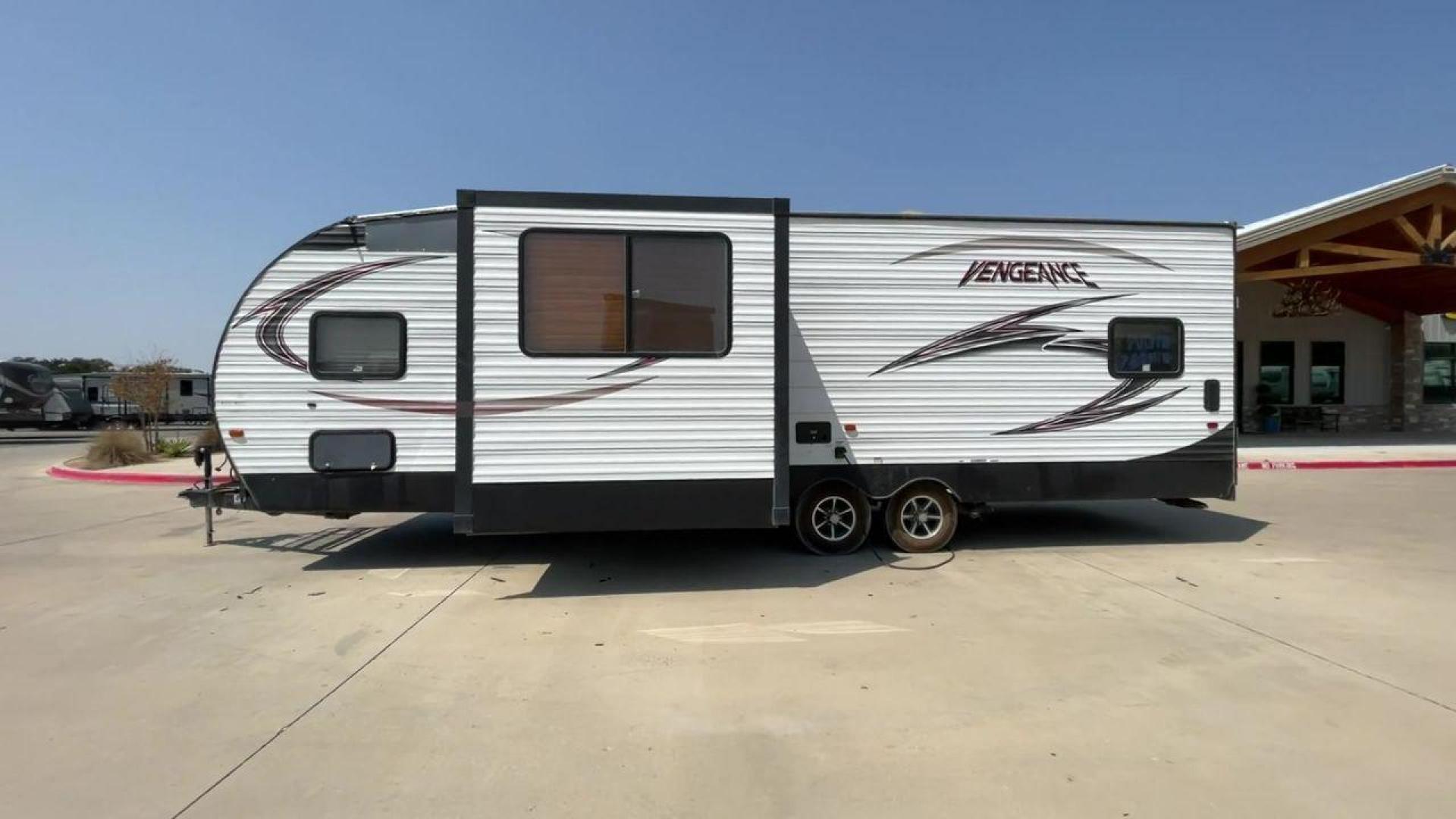 2015 WHITE VENGEANCE SU 29V (4X4TVGE24FY) , Length: 34.5 ft. | Dry Weight: 7,618 lbs. | Gross Weight: 9,985 lbs. | Slides: 1 transmission, located at 4319 N Main St, Cleburne, TX, 76033, (817) 678-5133, 32.385960, -97.391212 - The 2015 Vengeance SU 29V is a versatile and spacious toy hauler, ideal for outdoor enthusiasts who crave adventure. With a length of 34.5 feet and a dry weight of 7,618 pounds, this travel trailer provides generous storage space while ensuring your comfort is not compromised. With a single slide, t - Photo#6