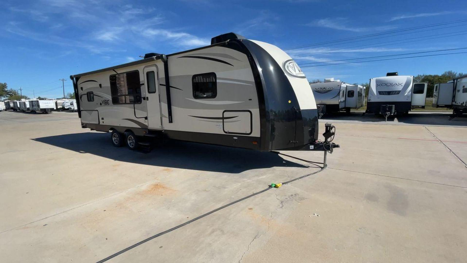 2015 TAN VIBE EXTREME 268RKS (4X4TVBC29F4) , Length: 32 ft. | Dry Weight: 6,398 lbs. | Slides: 1 transmission, located at 4319 N Main St, Cleburne, TX, 76033, (817) 678-5133, 32.385960, -97.391212 - The 2015 Vibe Extreme 268RKS travel trailer will significantly serve you with its amenities and features. This trailer only measures 32 ft in length, 8 ft in width, and 11 ft in height. It has a dry weight of 6,398 lbs with a payload capacity of 1,867 lbs and a hitch weight of 742 lbs. A small k - Photo#3