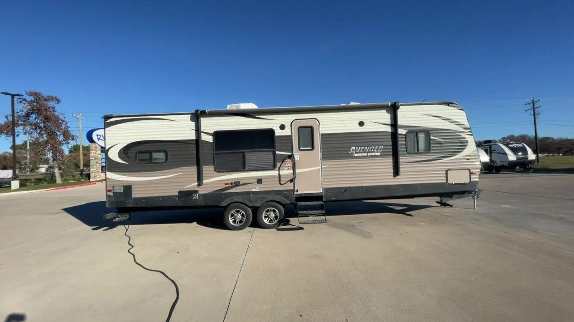 2016 FOREST RIVER AVENGER 28RKS - (5ZT2AVTBXGB) , located at 4319 N Main St, Cleburne, TX, 76033, (817) 678-5133, 32.385960, -97.391212 - Photo#2