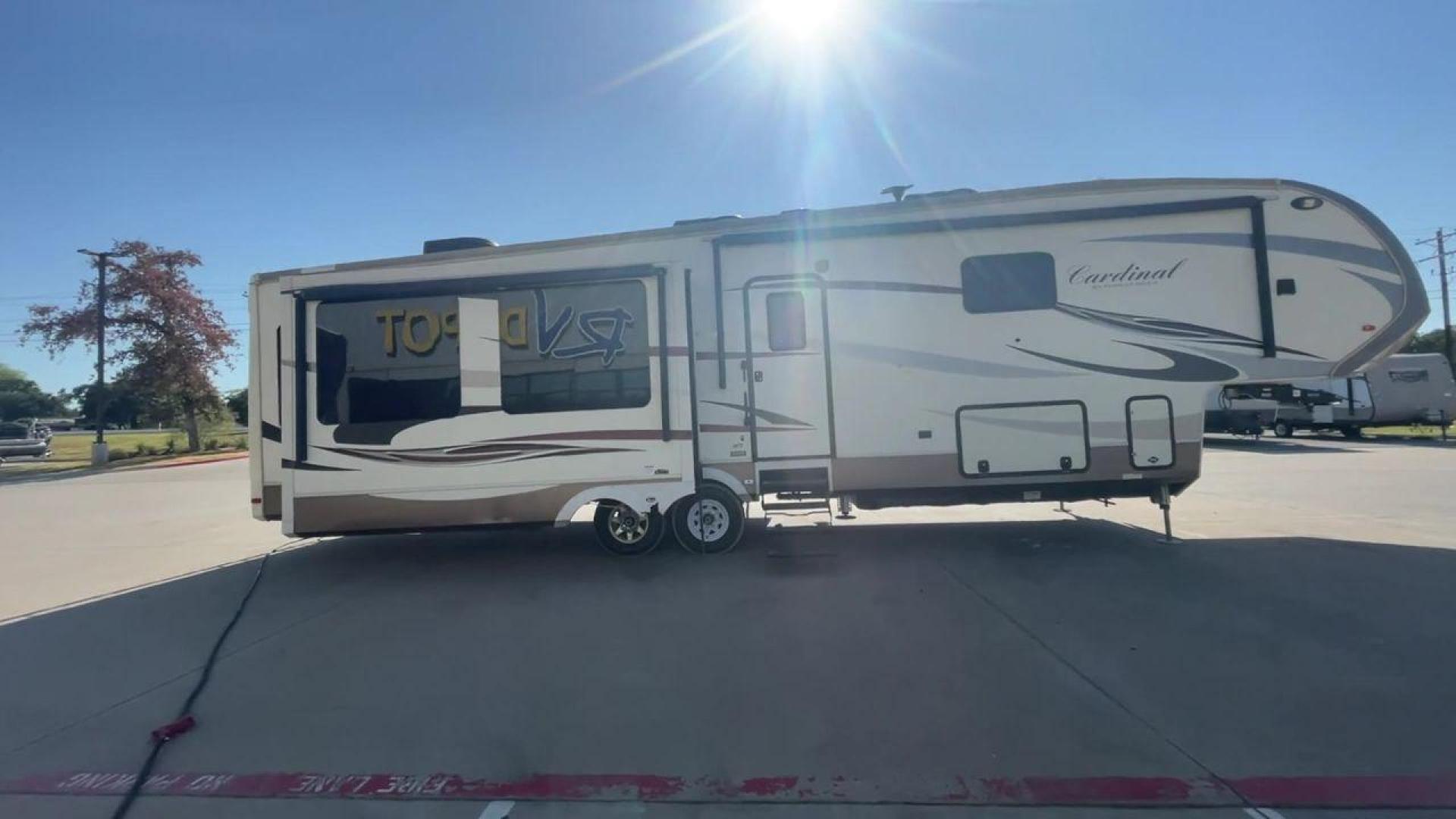 2016 BEIGE FOREST RIVER CARDINAL 3875FB - (4X4FCAR23GG) , Length: 40.5 ft. | Dry Weight: 14,034 lbs. | Gross Weight: 16,170 lbs. | Slides: 3 transmission, located at 4319 N Main St, Cleburne, TX, 76033, (817) 678-5133, 32.385960, -97.391212 - The elegant and well-equipped 2016 Forest River Cardinal 3875FB travel trailer will elevate your camping experience. Designed with care, this fifth wheel provides you with comfort, utility, and style for your road trips. This fifth wheel have dimensions of 40.5 ft in length, 8.33 ft in width, and 13 - Photo#2