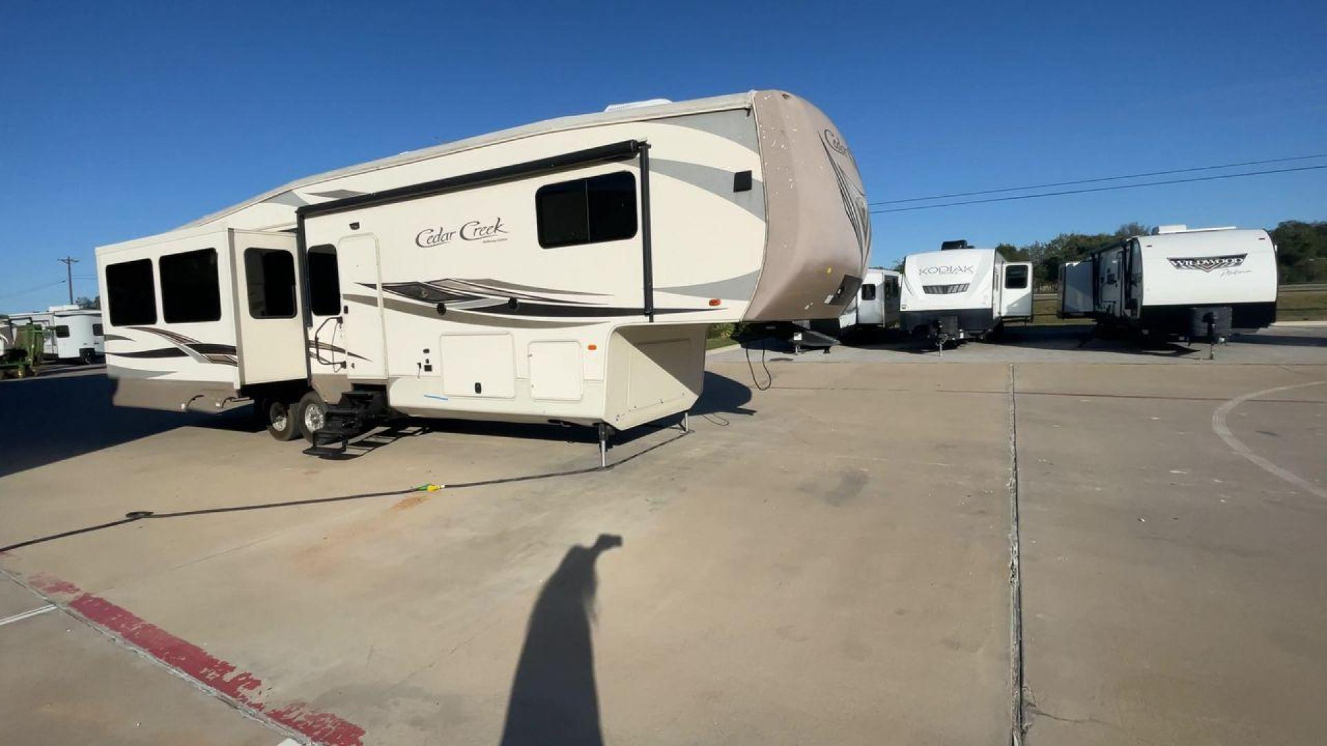 2016 FOREST RIVER CEDAR CREEK 36CKTS - (4X4FCRM24GS) , Length: 39.83 ft. | Dry Weight: 12,670 lbs. | Gross Weight: 16,407 lbs. | Slides: 3 transmission, located at 4319 N Main St, Cleburne, TX, 76033, (817) 678-5133, 32.385960, -97.391212 - Photo#3