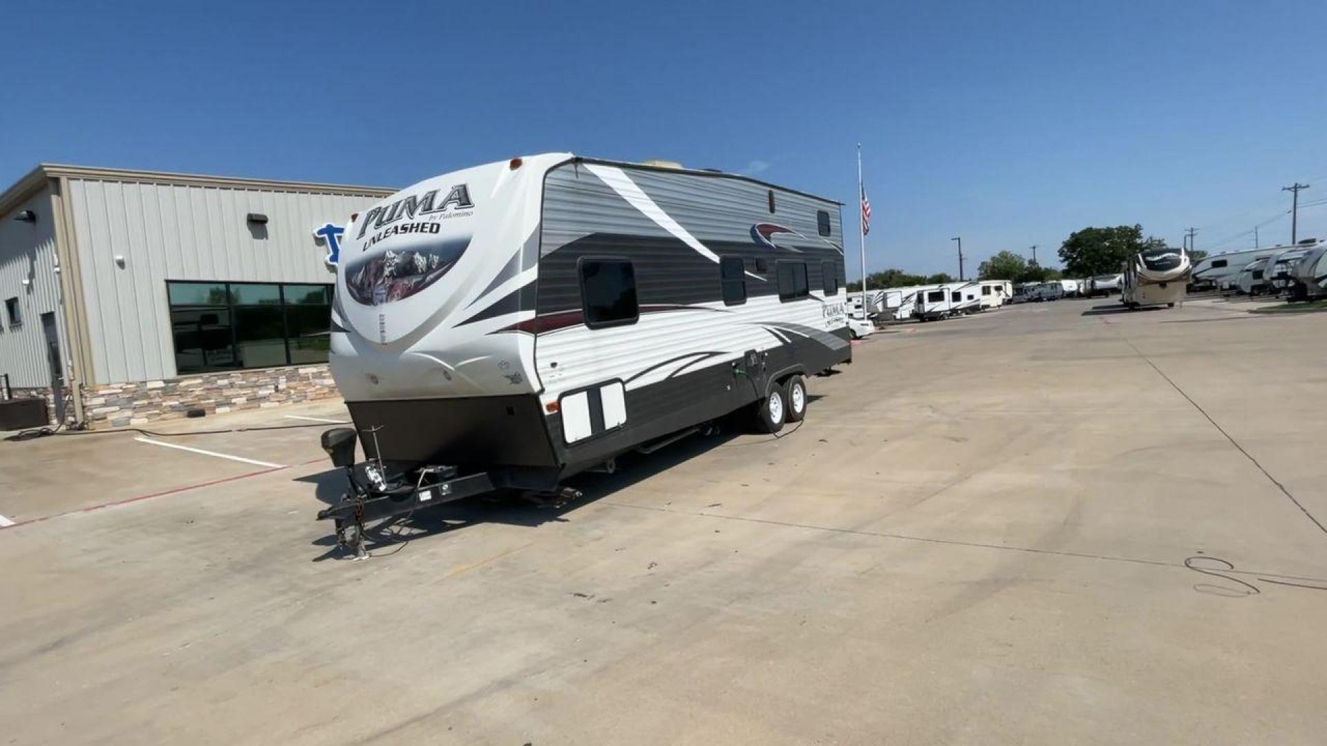 2016 FOREST RIVER PUMA UNLEASHED 25TFS (4X4TPTA27GP) , Length: 29.67 ft. | Dry Weight: 6,991 lbs. | Gross Weight: 9,939 lbs. | Slides: 0 transmission, located at 4319 N Main St, Cleburne, TX, 76033, (817) 678-5133, 32.385960, -97.391212 - This 2016 Forest River Puma Unleashed 25TFS measures just under 30 feet long. It has a dry weight of 6,991 lbs. and a GVWR of 9,939 lbs. It comes equipped with automatic heating and cooling rated at 30,000 and 13,500 BTUs respectively. It is also designed with a 14-foot power awning. This toy hau - Photo#5