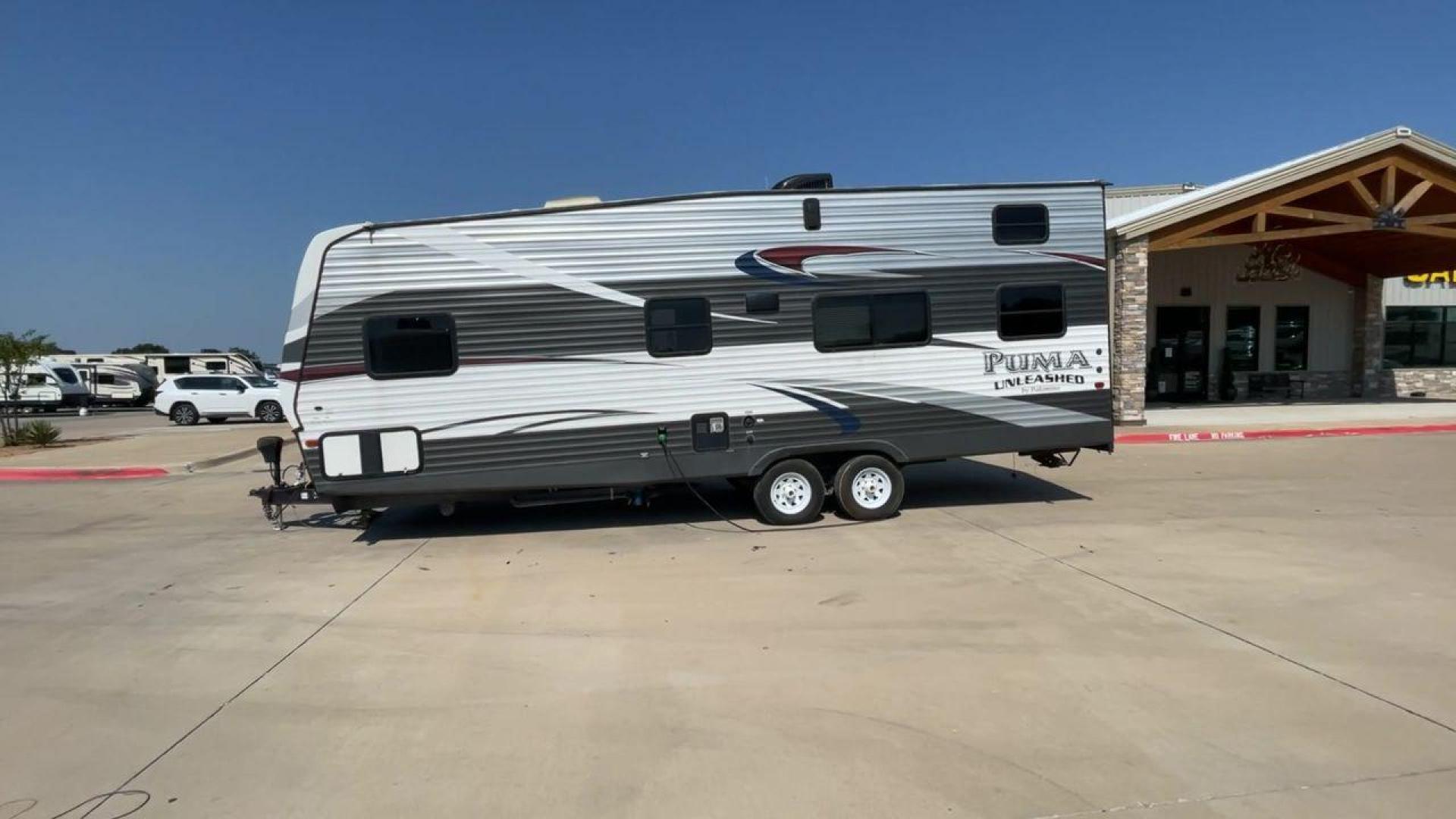 2016 FOREST RIVER PUMA UNLEASHED 25TFS (4X4TPTA27GP) , Length: 29.67 ft. | Dry Weight: 6,991 lbs. | Gross Weight: 9,939 lbs. | Slides: 0 transmission, located at 4319 N Main St, Cleburne, TX, 76033, (817) 678-5133, 32.385960, -97.391212 - This 2016 Forest River Puma Unleashed 25TFS measures just under 30 feet long. It has a dry weight of 6,991 lbs. and a GVWR of 9,939 lbs. It comes equipped with automatic heating and cooling rated at 30,000 and 13,500 BTUs respectively. It is also designed with a 14-foot power awning. This toy hau - Photo#6