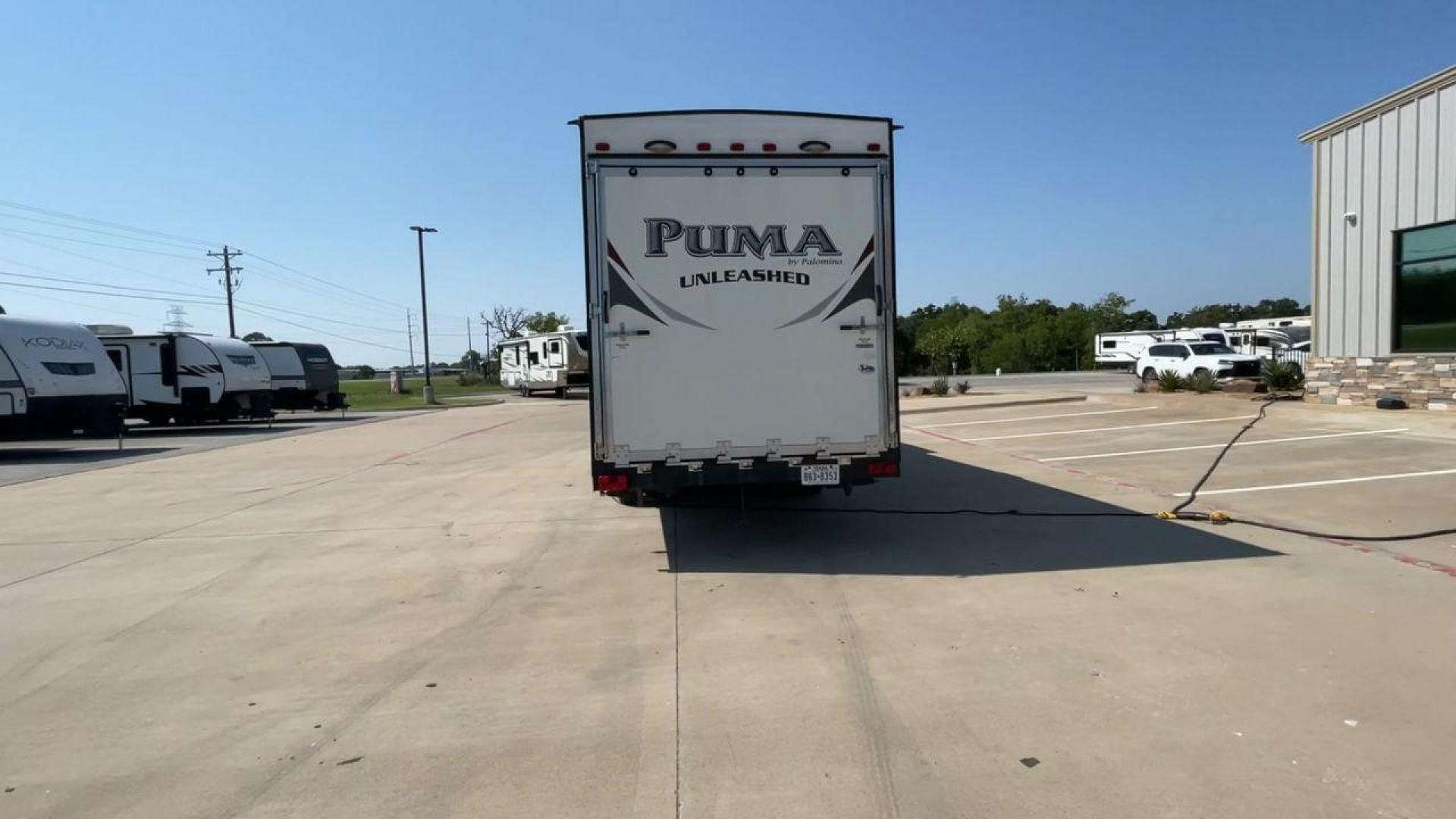 2016 FOREST RIVER PUMA UNLEASHED 25TFS (4X4TPTA27GP) , Length: 29.67 ft. | Dry Weight: 6,991 lbs. | Gross Weight: 9,939 lbs. | Slides: 0 transmission, located at 4319 N Main St, Cleburne, TX, 76033, (817) 678-5133, 32.385960, -97.391212 - This 2016 Forest River Puma Unleashed 25TFS measures just under 30 feet long. It has a dry weight of 6,991 lbs. and a GVWR of 9,939 lbs. It comes equipped with automatic heating and cooling rated at 30,000 and 13,500 BTUs respectively. It is also designed with a 14-foot power awning. This toy hau - Photo#8