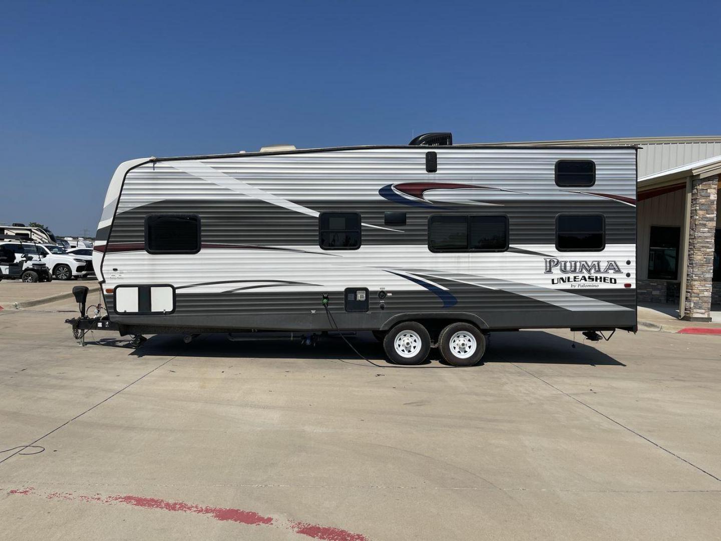 2016 FOREST RIVER PUMA UNLEASHED 25TFS (4X4TPTA27GP) , Length: 29.67 ft. | Dry Weight: 6,991 lbs. | Gross Weight: 9,939 lbs. | Slides: 0 transmission, located at 4319 N Main St, Cleburne, TX, 76033, (817) 678-5133, 32.385960, -97.391212 - This 2016 Forest River Puma Unleashed 25TFS measures just under 30 feet long. It has a dry weight of 6,991 lbs. and a GVWR of 9,939 lbs. It comes equipped with automatic heating and cooling rated at 30,000 and 13,500 BTUs respectively. It is also designed with a 14-foot power awning. This toy hau - Photo#24